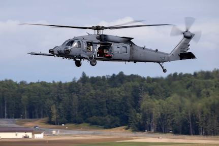 An Alaska Air National Guard HH-60W Jolly Green II crew preparing to support the Arctic Thunder Open House quickly shifted to a real-world mission Aug. 9, rescuing the pilot of a crashed Cessna 185 near Trapper Joe Lake.