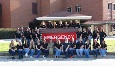 Womack Army Medical Center forensic healthcare examiners pose for a group photo during their annual competency training at Fort Bragg, N.C., June 25, 2026. The training convened more than 30 forensic nurses, medical providers, and legal experts to refine the clinical and courtroom proficiencies essential for the comprehensive care of trauma victims