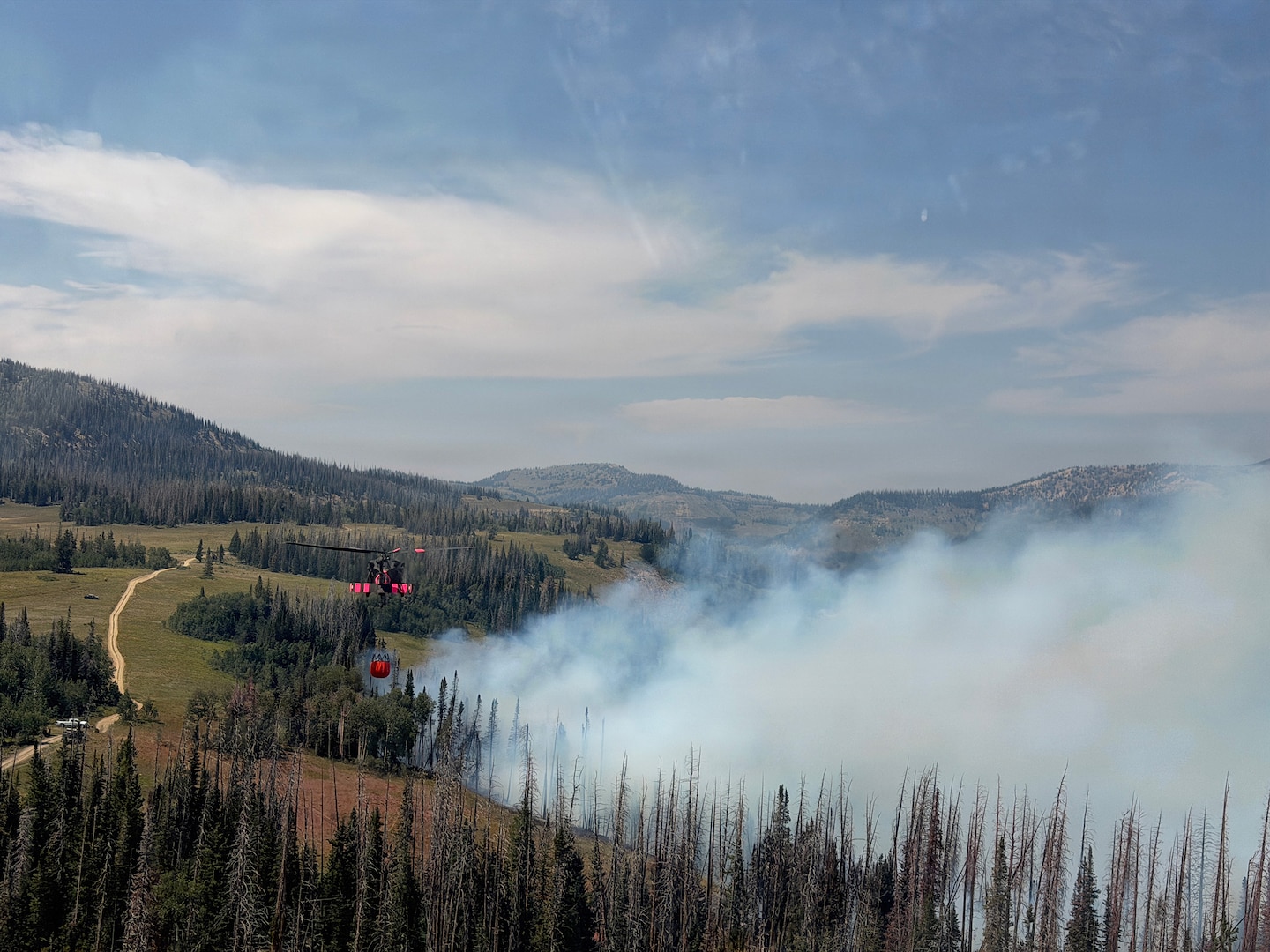 A Utah National Guard UH-60 Black Hawk conducts aerial firefighting operations in support of the Black Canyon Fire in Sanpete County, Utah.