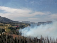 A Utah National Guard UH-60 Black Hawk conducts aerial firefighting operations in support of the Black Canyon Fire in Sanpete County, Utah.