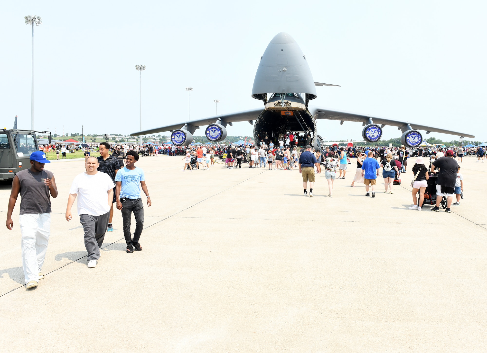 Local community members stroll on the flightline during the 2026 Defenders of Freedom Air & Space Show at Offutt Air Force Base, Nebraska, Aug. 8, 2026. The event served as a platform to celebrate Offutt Air Force Base's military heritage, honoring the unique civilian-military bond with the Greater Omaha community that has supported the nation's defense for generations. (U.S. Air Force photo by Charles Haymond)