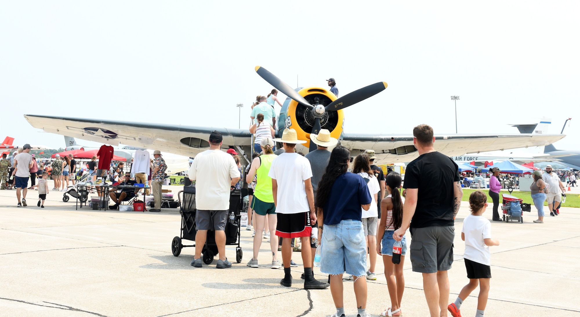An audience tours a TBM Avenger during the Defenders of Freedom Air & Space Show 2026 at Offutt Air Force Base, Nebraska, Aug. 9, 2026. The event served as a platform to celebrate Offutt's military heritage, honoring the unique civilian-military bond with the Greater-Omaha community that has supported the nation's defense for generations. (U.S. Air Force photo by Charles J. Haymond)