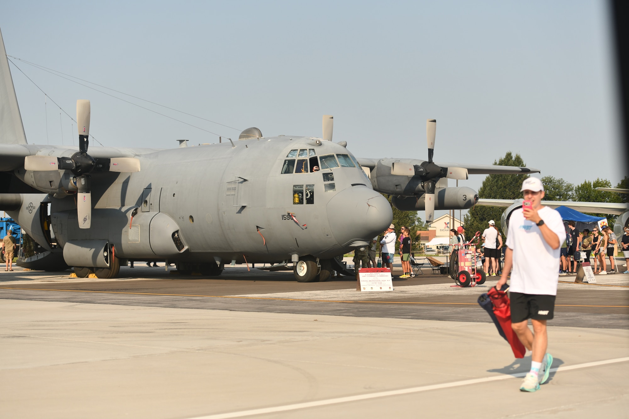 A crowd of people walk by an EC-130H Compass Call during the 2026 Defenders of Freedom Air & Space Show at Offutt Air Force Base, Nebraska, Aug. 9, 2026. Defenders of Freedom Air & Space Show 2026 served as a free, public open house to foster strong community relations and express appreciation to the local Greater Omaha community. (U.S. Air Force photo by Chad Watkins)