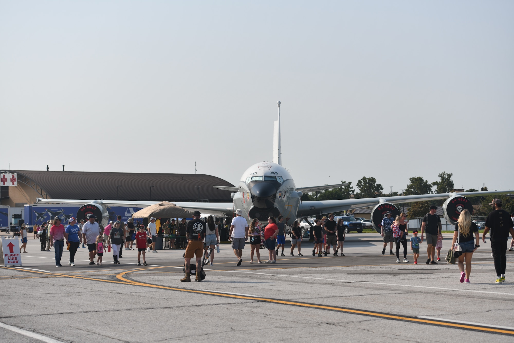 A crowd of people walk by an RC-135U Combat Sent during the 2026 Defenders of Freedom Air & Space Show at Offutt Air Force Base, Nebraska, Aug. 9, 2026. Defenders of Freedom Air & Space Show 2026 served as a free, public open house to foster strong community relations and express appreciation to the local Greater Omaha community. (U.S. Air Force photo by Chad Watkins)