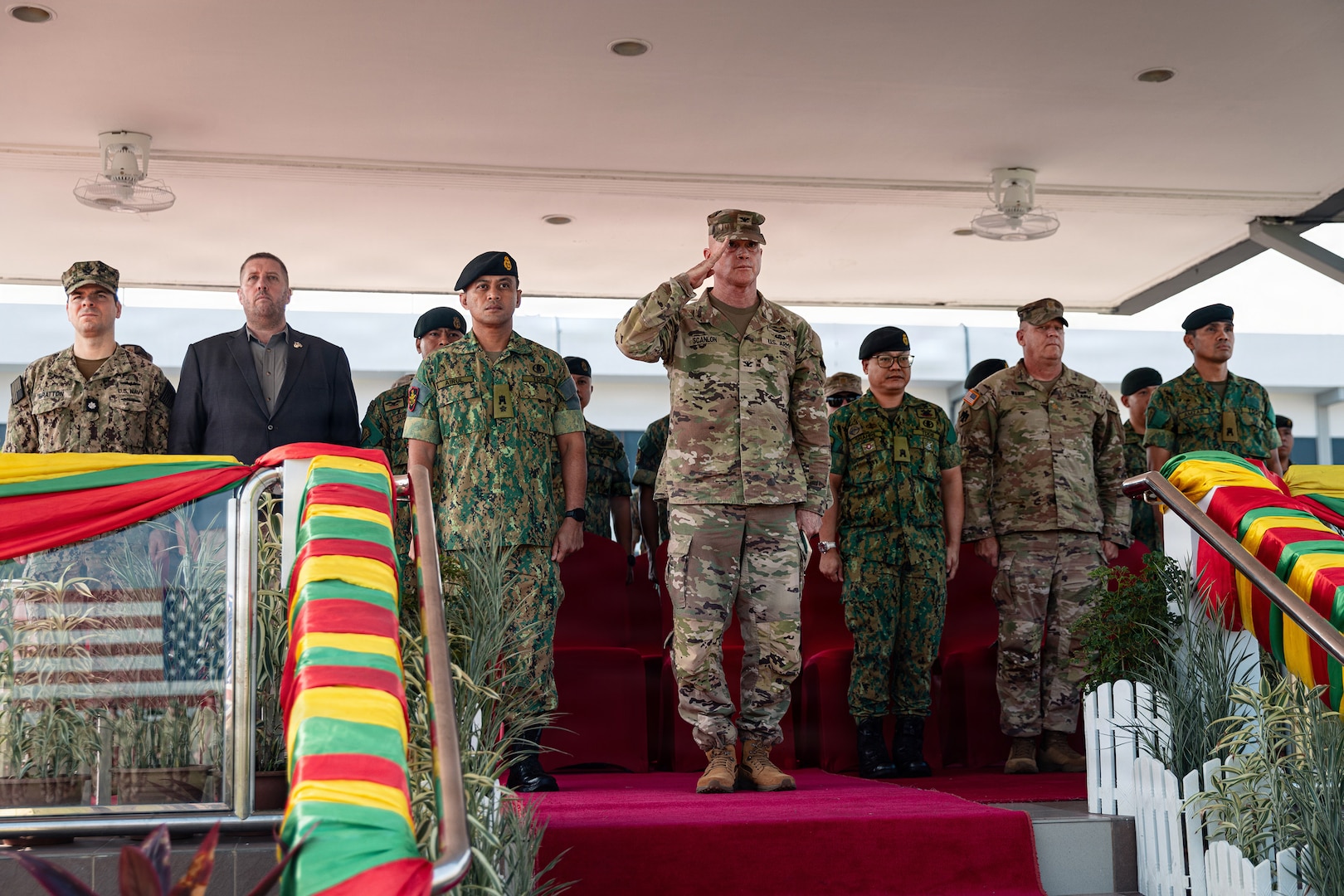 U.S. Army Col. Michael Scanlon, deputy chief of staff for operations, Oklahoma Army National Guard salutes the formation during the opening ceremony for Exercise Pahlawan Warrior 26 at Tutong Camp near Bandar Seri Begawan, Brunei, Aug. 11, 2026.