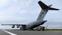 A U.S. Army M142 High Mobility Artillery Rocket System, assigned to 17th Long Range Fires and Effects Brigade, gets loaded into a Royal Canadian Air Force C-17 Globemaster III aircraft in Nome, Alaska, Aug. 11, 2026. The HIMARS was deployed to the Arctic from Joint Base Lewis-McChord in support of Operation TUNDRA MERLIN, showcasing U.S. and Canadian forces' ability to rapidly move combat equipment and personnel across the Arctic. (U.S. Air Force photo by Senior Airman Gabriel Held)