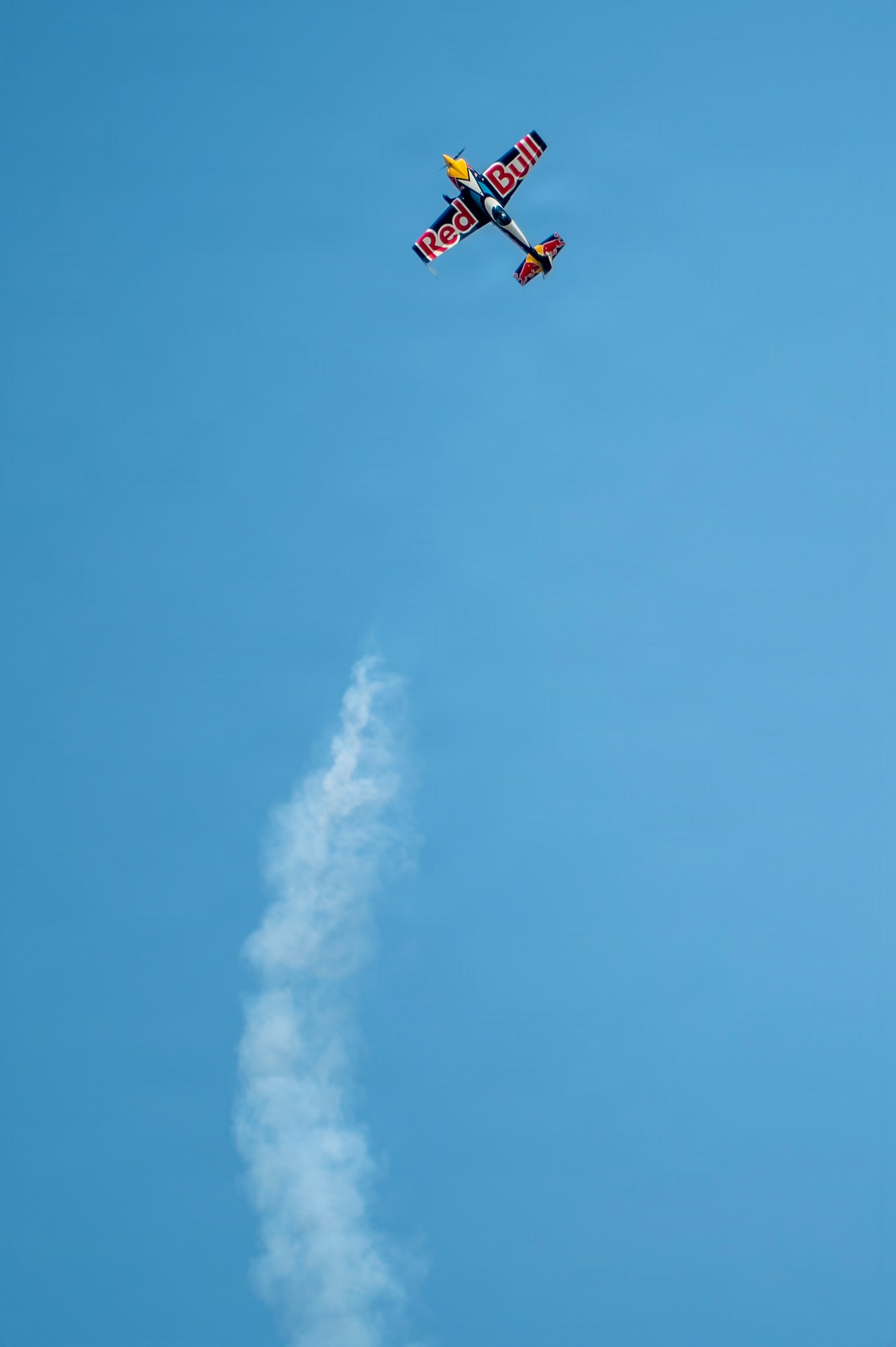 Red Bull Air Force executes a high-energy aerial stunt display over the flightline during the 2026 Defenders of Freedom Air & Space Show at Offutt Air Force Base, Nebraska, Aug. 8, 2026. The air show served as a free, public open house to foster strong community relations and express appreciation to the local Greater Omaha community. (U.S. Air Force photo by Senior Airman Matthew Arachikavitz)