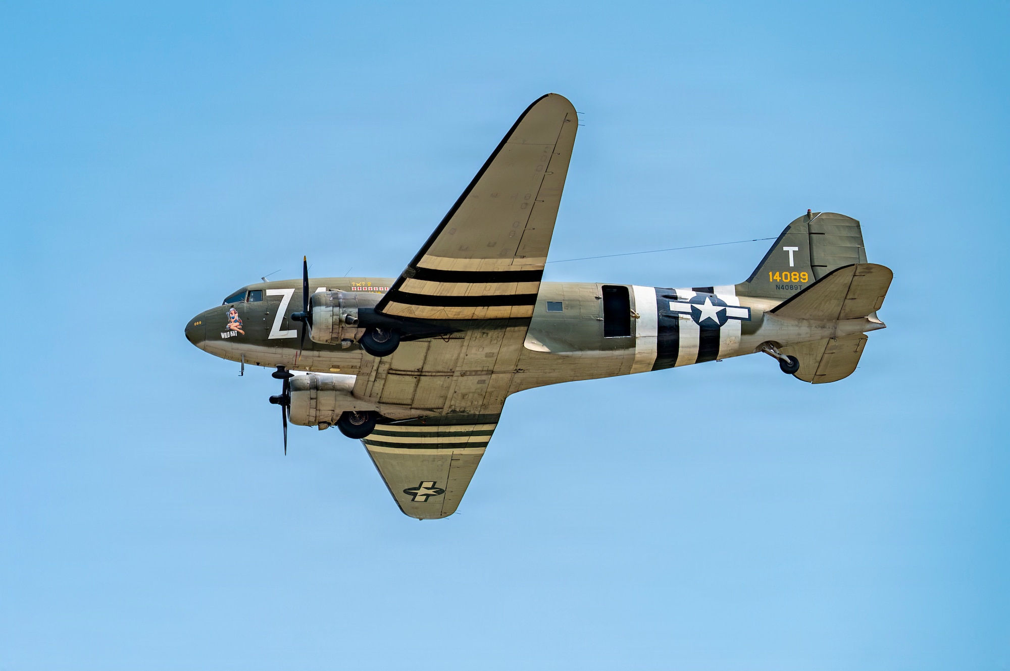 A C-47 Skytrain performs a flyover during the 2026 Defenders of Freedom Air & Space Show opening ceremony at Offutt Air Force Base, Nebraska, Aug. 8, 2026. In alignment with the nationwide 'Freedom 250' celebration, the air show highlighted two and a half centuries of American progress, liberty, and the technological leaps made throughout military aviation history. (U.S. Air Force photo by Senior Airman Matthew Arachikavitz)