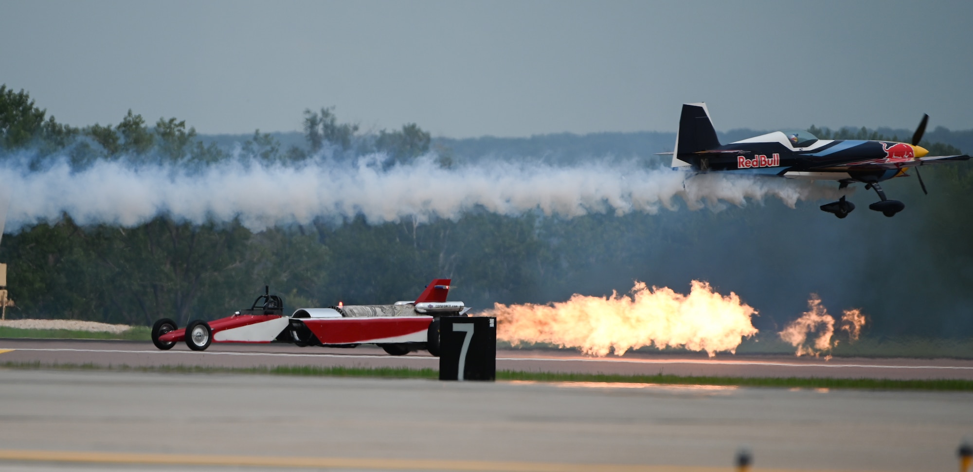 Red Bull Air Force races the Smoke n Thunder jet car on the flightline during the 2026 Defenders of Freedom Air & Space Show at Offutt Air Force Base, Nebraska, Aug. 9, 2026.The biennial air show served as a key community outreach event, aiming to inspire the next generation of aviators by highlighting the diverse career paths and unwavering dedication of today's Airmen. (U.S. Air Force Photo by Airman 1st Class Charles Bolden)
