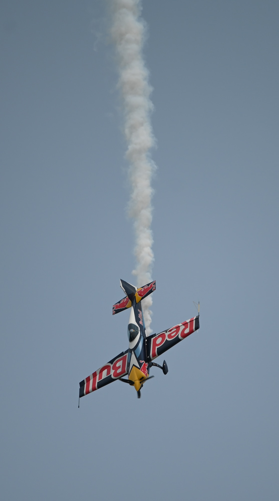 Red Bull Air Force executes a high-energy aerial stunt display over the flightline during the 2026 Defenders of Freedom Air & Space Show at Offutt Air Force Base, Nebraska, Aug. 9, 2026. The event served as a platform to celebrate Offutt AFB's military heritage, honoring the unique civilian-military bond with the Greater Omaha community that has supported the nation's defense for generations. (U.S. Air Force Photo by Airman 1st Class Charles Bolden)