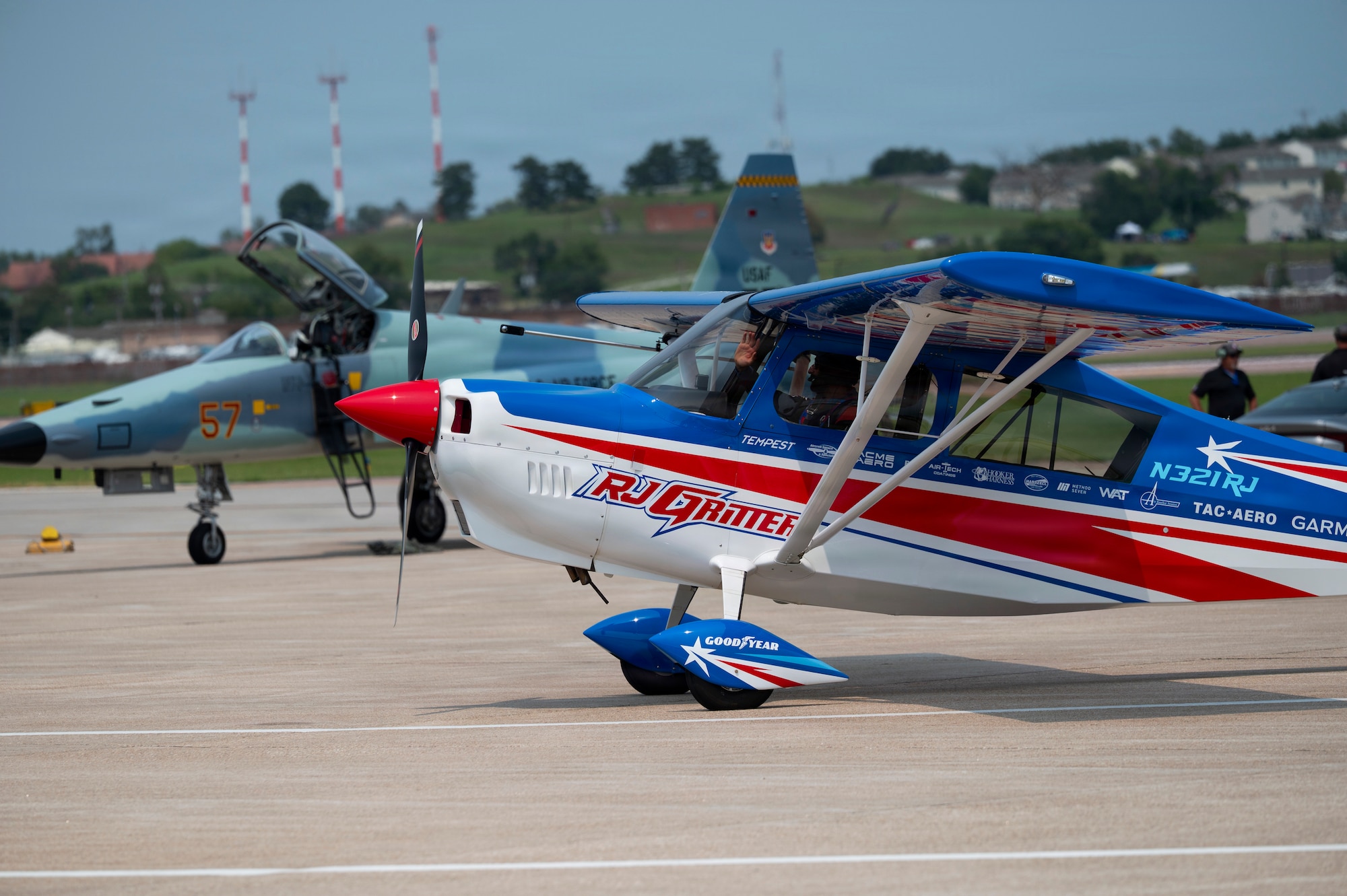 RJ Gritter waves to air show attendees during the 2026 Defenders of Freedom Air & Space Show at Offutt Air Force Base, Nebraska, Aug. 9, 2026. DoF 2026 served as a free, public open house to foster strong community relations and express appreciation to the local Greater Omaha community. (U.S. Air Force photo by Senior Airman Matthew Arachikavitz)