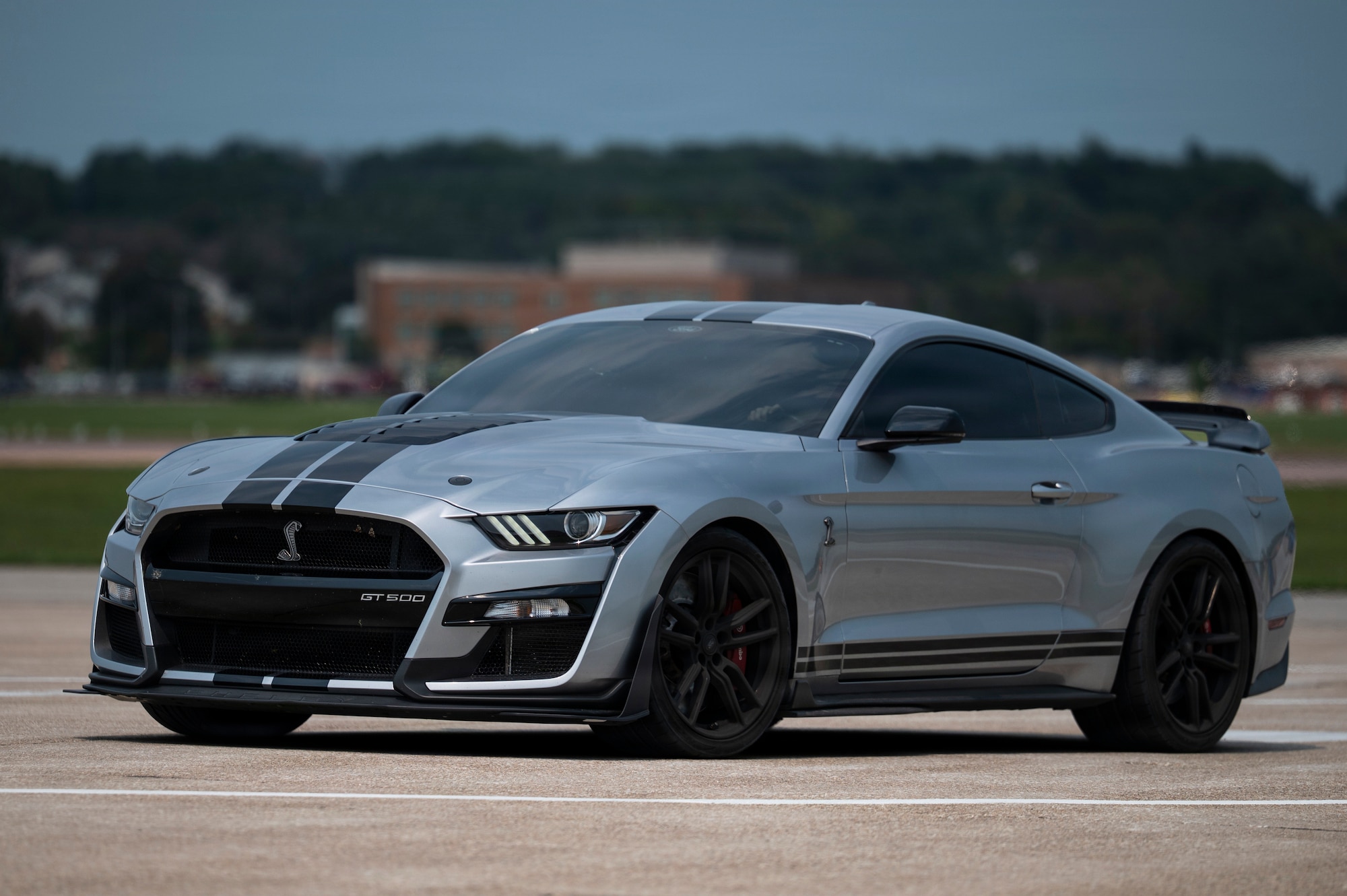 Precision Exotics drive a silver Ford Shelby GT500 on the flightline during the 2026 Defenders of Freedom Air & Space Show at Offutt Air Force Base, Nebraska, Aug. 9, 2026. DoF 2026 served as a free, public open house to foster strong community relations and express appreciation to the local Greater Omaha community. (U.S. Air Force photo by Senior Airman Matthew Arachikavitz)