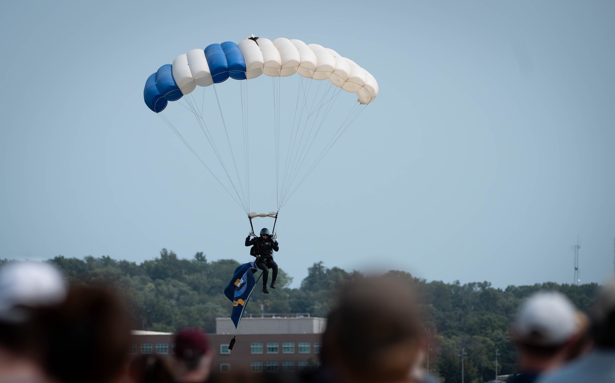 A member of the U.S. Air Force Academy Wings of Blue parachuting team prepares to land during the 2026 Defenders of Freedom Air & Space Show at Offutt Air Force Base, Nebraska, Aug. 9, 2026. Defenders of Freedom Air & Space Show 2026 was designed to educate the public on the strategic importance of Offutt AFB and the many worldwide missions it supports, providing a firsthand look at the advanced aircraft and highly trained personnel required to execute operations globally. (U.S. Air Force photo by Daniel Martinez)