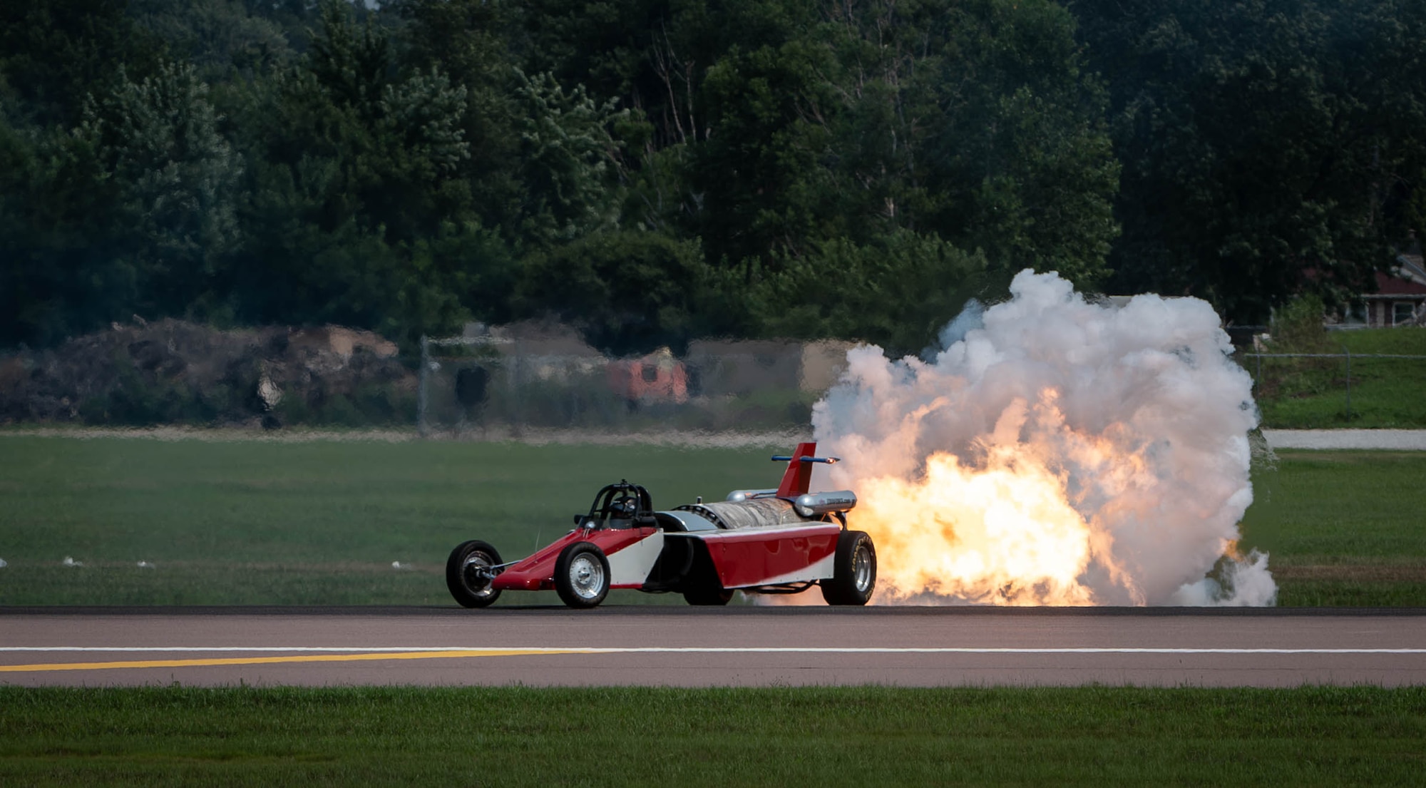 The Smoke N Thunder JetCar ignites it's jet engine to prepare for it's ascent down the runway during the 2026 Defenders of Freedom Air & Space Show at Offutt Air Force Base, Nebraska, Aug. 9, 2026. The biennial air show served as a key community outreach event, aiming to inspire the next generation of aviators by highlighting the diverse career paths and unwavering dedication of today's Airmen. (U.S. Air Force photo by Daniel Martinez)