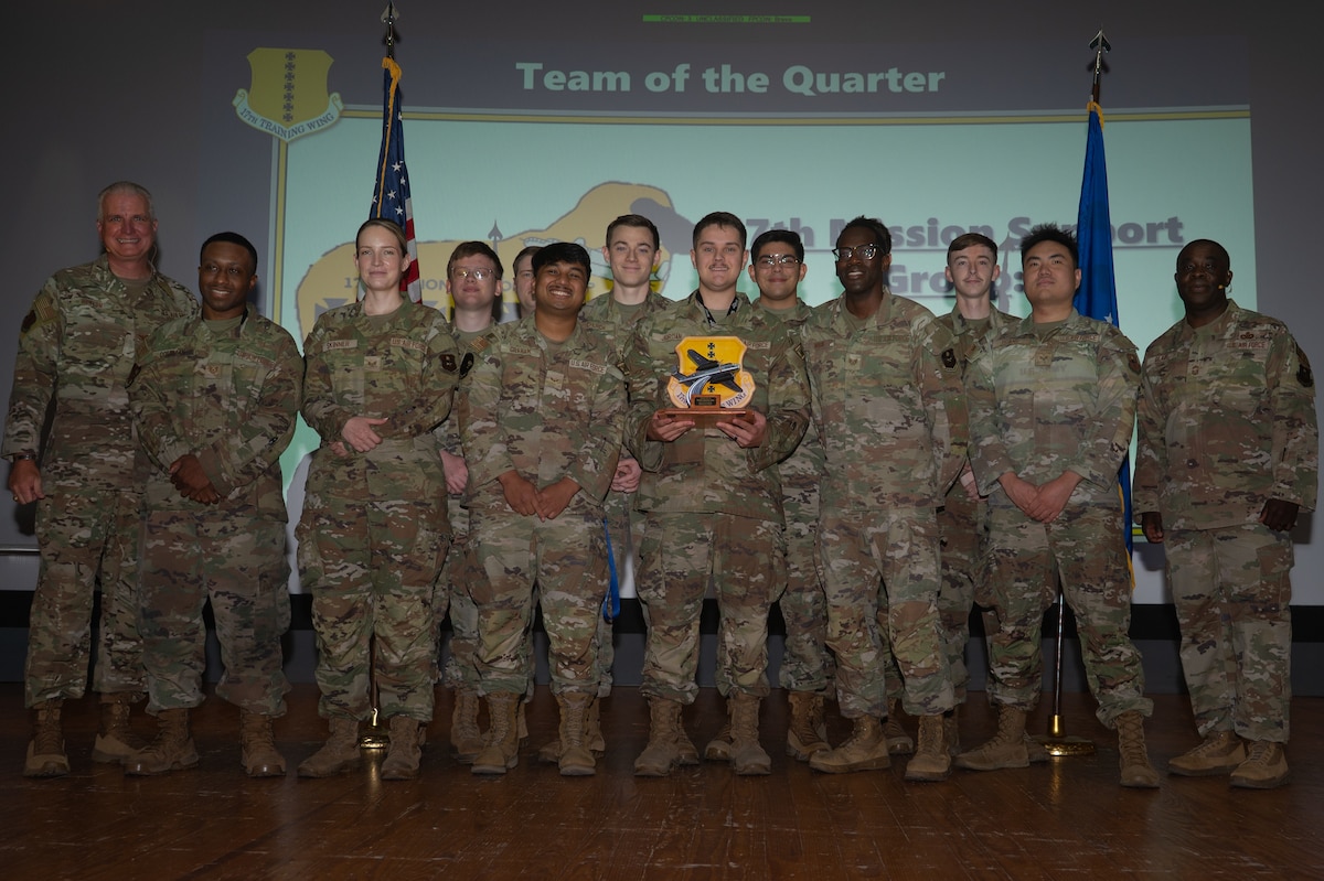 The 17th Communications Squadron System Operations team pose for a group photo with U.S. Air Force Col. Matthew Norton, 17th Training Wing commander, and Chief Master Sgt. Martez Blair, 17th Security Forces Squadron senior enlisted leader, during the 17th Training Wing second-quarter awards ceremony at Goodfellow Air Force Base, Texas, Aug. 7, 2026. The 17th CSSO won the Team of the Quarter award for their outstanding performance during April, May and June of 2026. (U.S. Air Force photo by Senior Airman Brian Lummus)