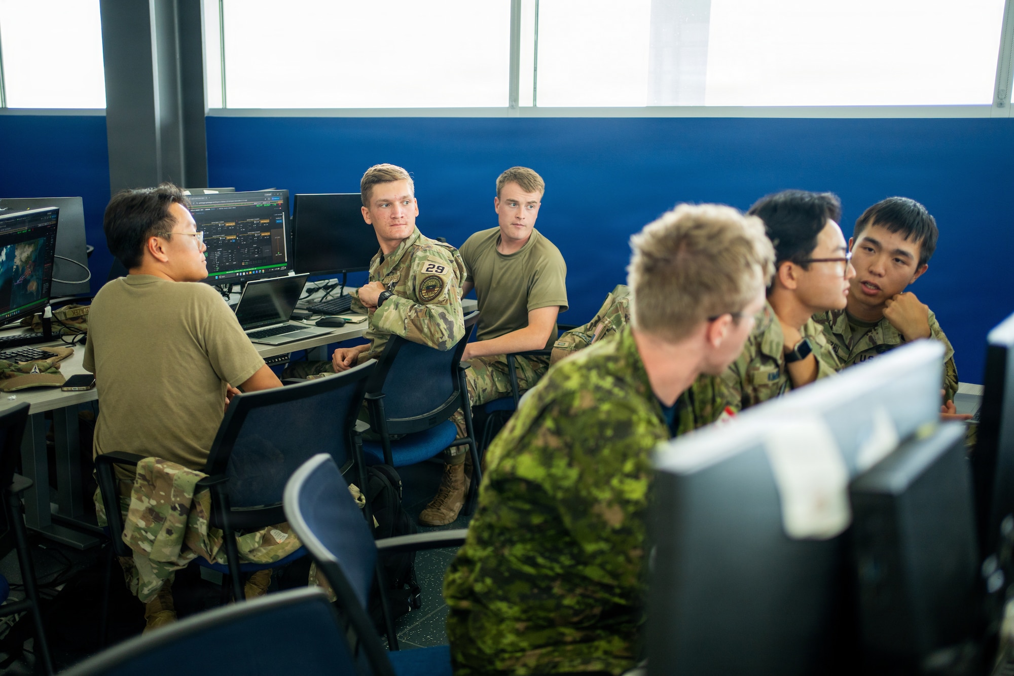 Cadets interacting in uniform at Azimuth program