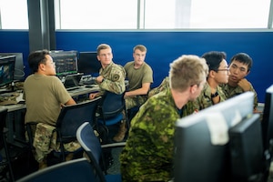 Cadets interacting in uniform at Azimuth program