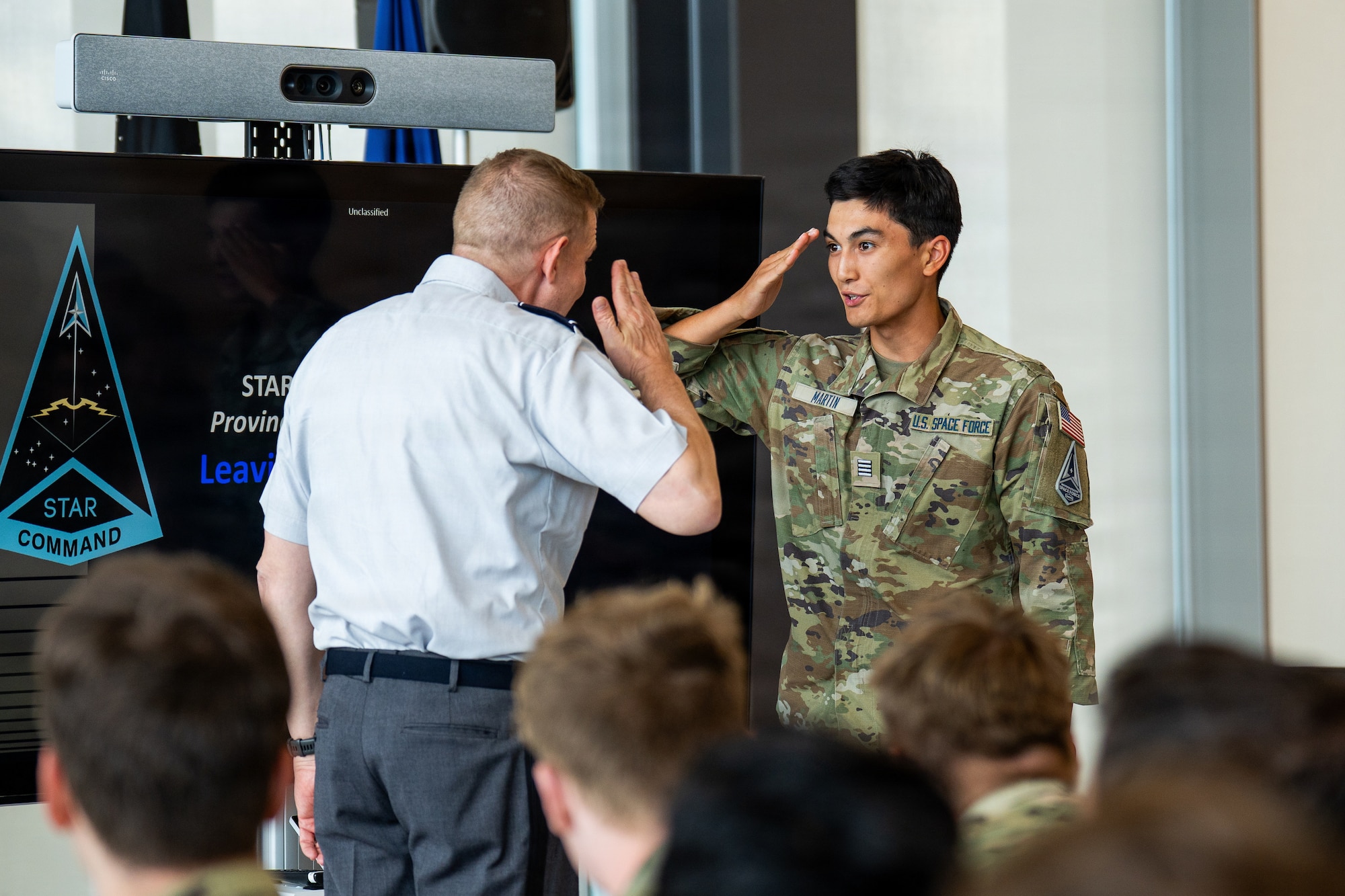 Cadets interacting in uniform at Azimuth program