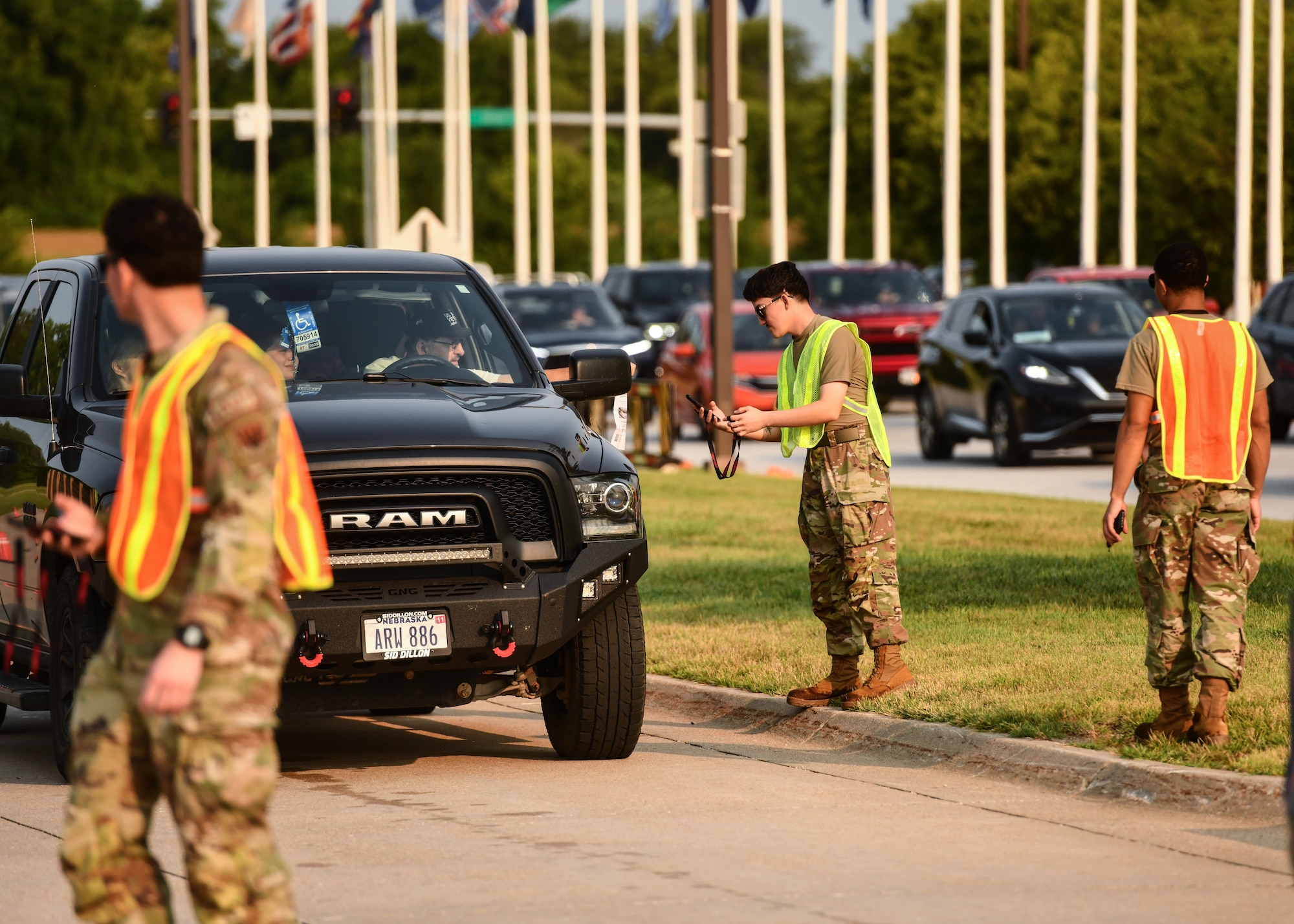 Defenders and augmentees of the 55th Security Forces Squadron check IDs and vehicle passes for the 2026 Defenders of Freedom Air and Space show on Offutt Air Force Base, August 8, 2026. Defenders of Freedom Air and Space Show 2026 served as a free, public open house to foster strong community relations and express appreciation to the local Greater Omaha community. (U.S. Air Force photo by Chad Watkins)