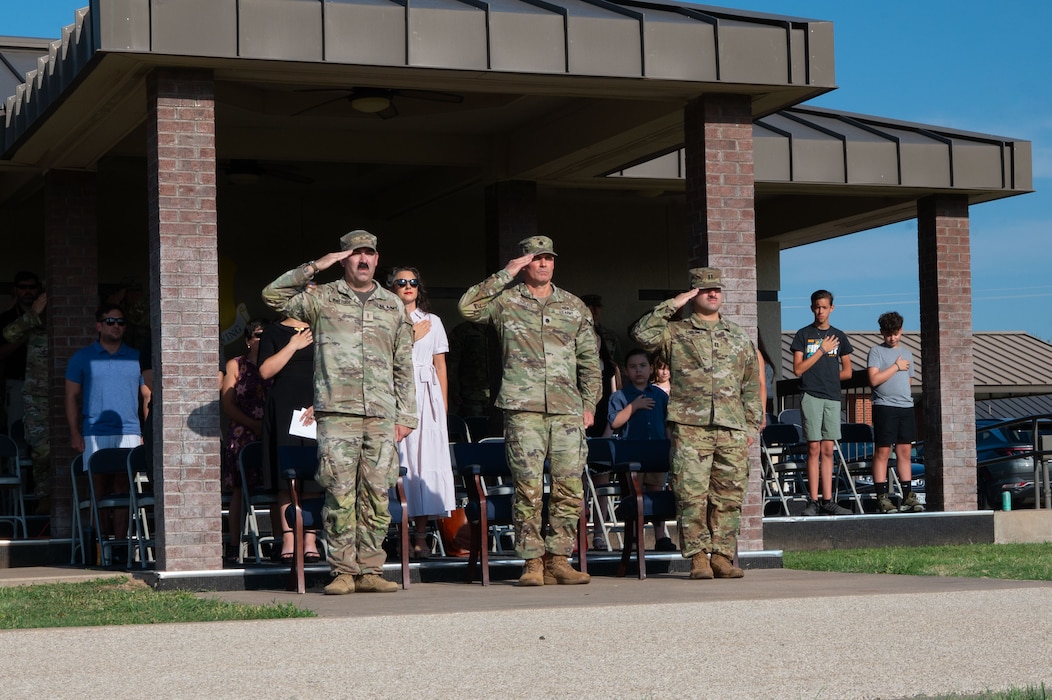 From left to right, U.S. Army Chief Warrant Officer 2 Remington Whiteside, outgoing Bravo Company, 344th Military Intelligence Battalion commander, Lt. Col. Jonathan Lovelace, 344th MI BN commander, and Capt. Andres Sanchez, incoming Bravo Company, 344th MI BN commander, salute during the presentation of the colors during a change of command ceremony at Goodfellow Air Force Base, Texas, Aug. 7, 2026.