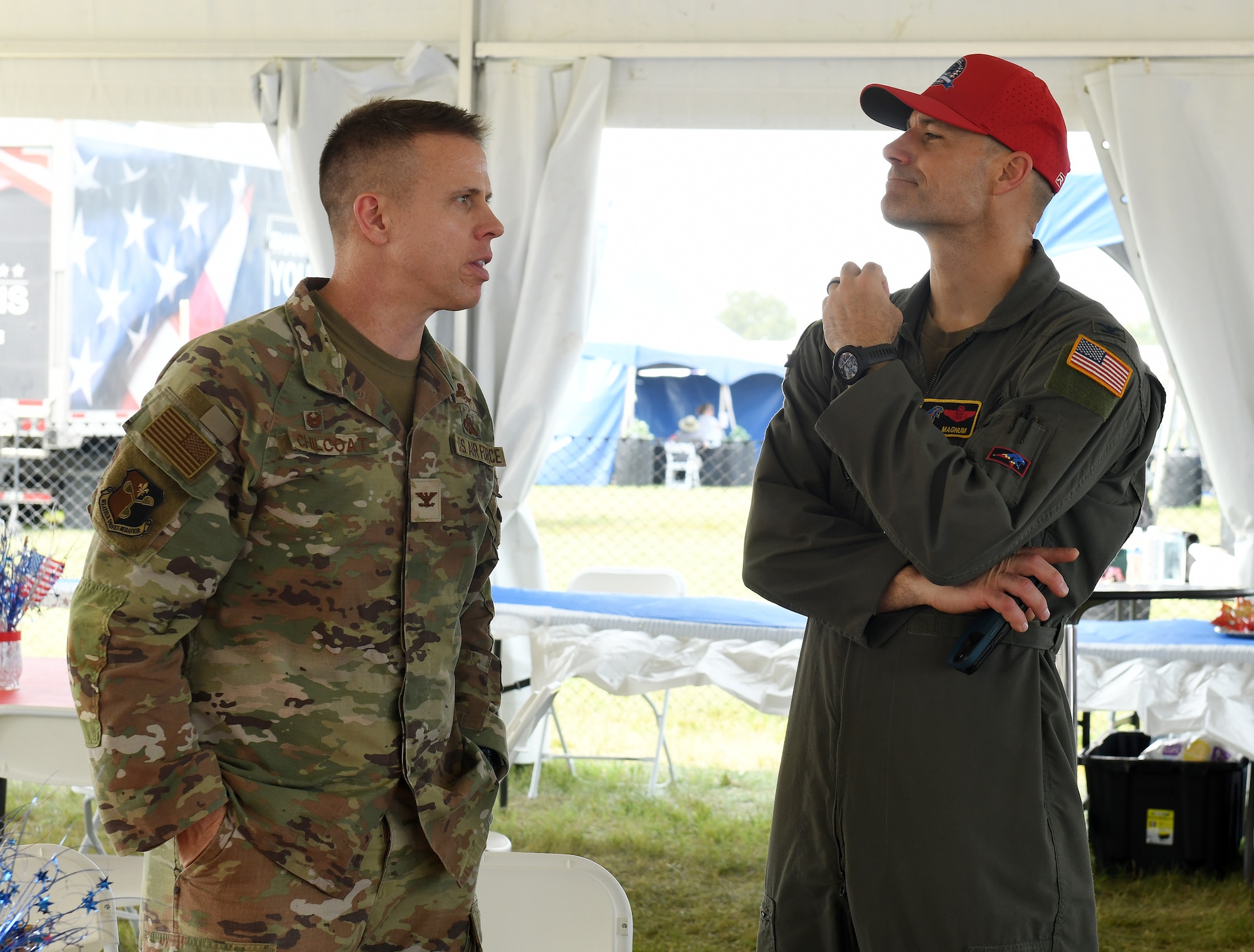 Col. Hank Chilcoat, 557th Weather Wing commander, and Col. Chad Backes, 55th Wing deputy commander, speak during the Defenders of Freedom Air and Space Show 2026 at Offutt Air Force Base, Nebraska, Aug. 9, 2026. In alignment with the nationwide 'Freedom 250' celebration, the air show highlighted two-and-a-half centuries of American progress, liberty, and the technological leaps made throughout military aviation history. (U.S. Air Force photo by Charles J. Haymond)