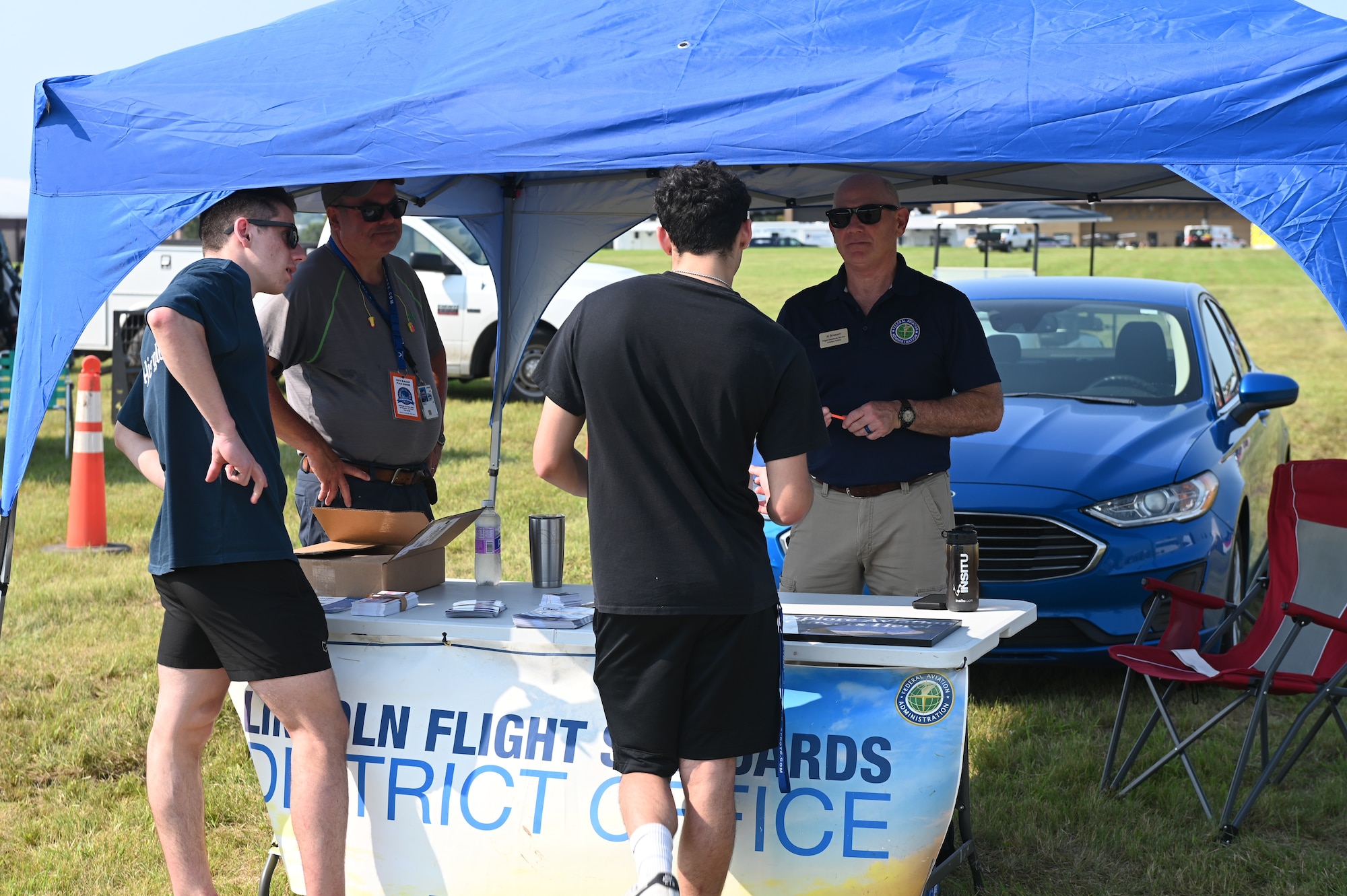 Defenders of Freedom Air & Space Show 2026 spectators visit the Lincoln Flight Standards District Office vendor at Offutt Air Force Base, Nebraska, Aug. 9, 2026. Spectators were given the opportunity to learn about what the flight standards district office community involvement and how they can participate. (U.S. Air Force photo by Airman 1st Class Charles Bolden)