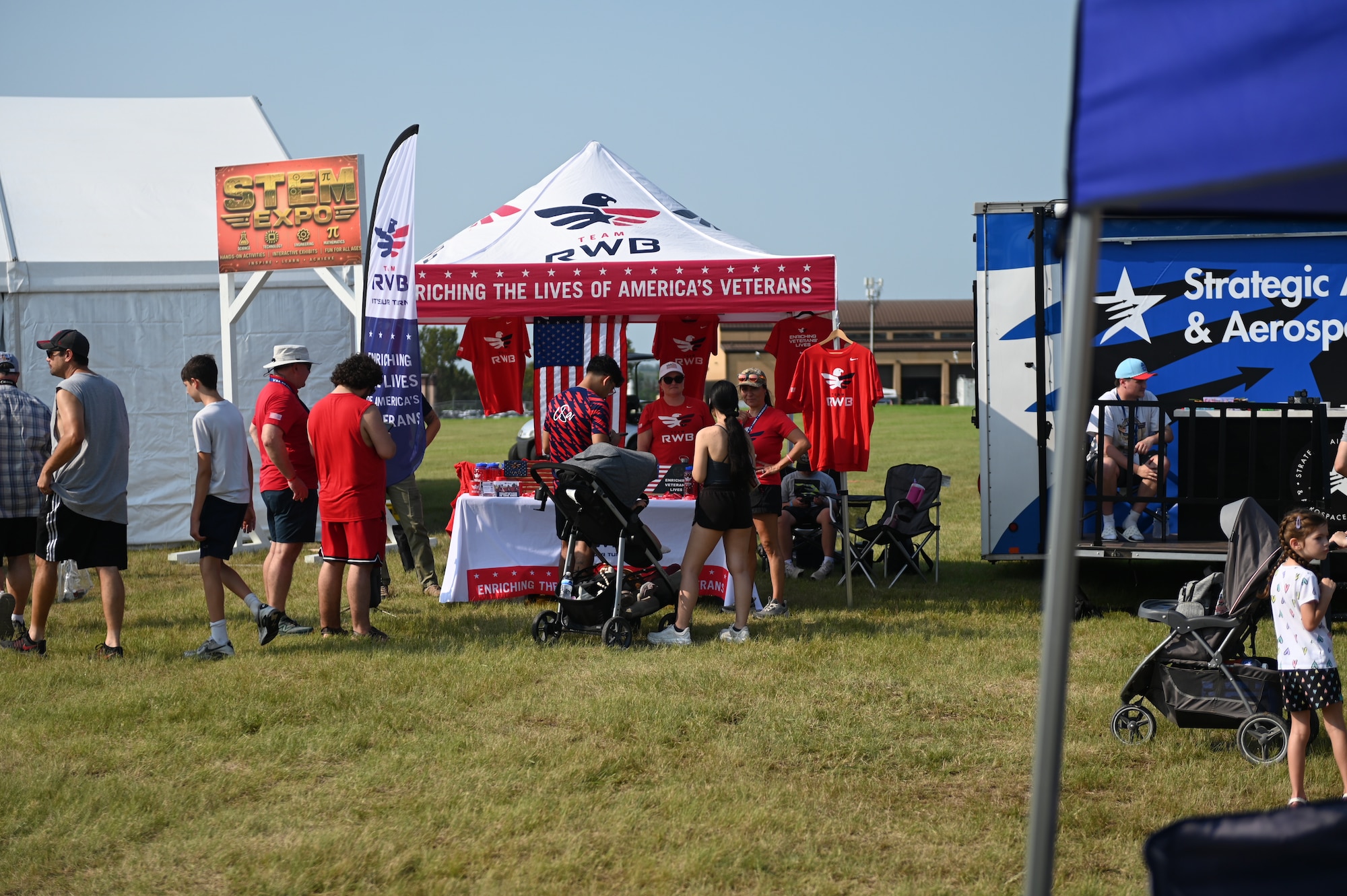 Team Red, White, Blue vendor talk to spectators at Defenders of Freedom Air & Space Show 2026 at Offutt Air Force Base, Nebraska, Aug. 9, 2026. The open house served as a free, public open house to foster strong community relations and express appreciation to the local Greater Omaha community.(U.S. Air Force photo by Airman 1st Class Charles Bolden)