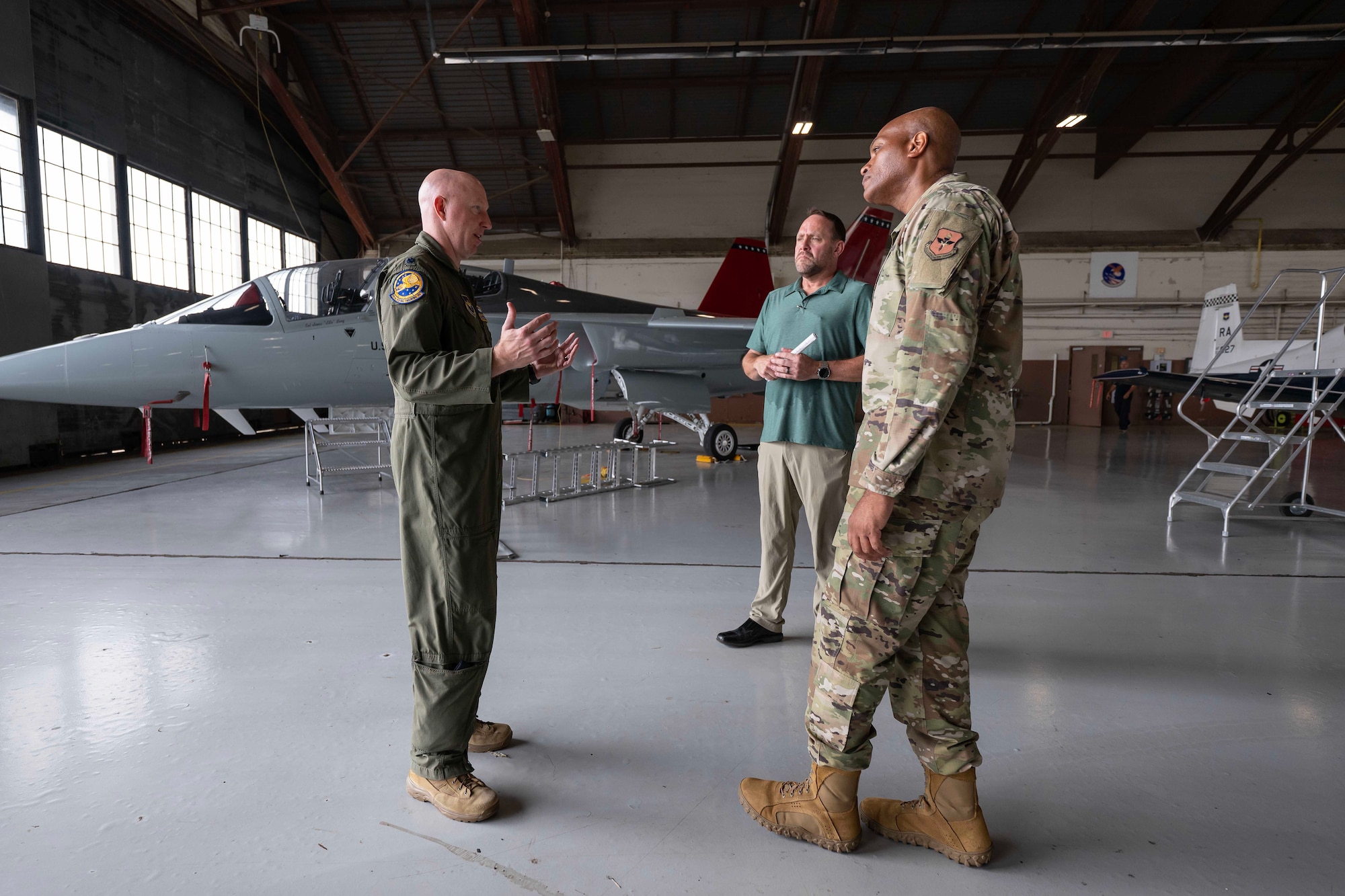 U.S. Air Force Lt. Col. Phillip Bourquin, 99th Flying Training Squadron director of operations, briefs Maj. Gen. Roy Collins, Air Education and Training Command deputy commander, about the training capabilities of the T-7A Red Hawk during his tour of the 12th Training Squadrons T-7A simulators and aircraft at Joint Base San Antonio-Randolph, July 29, 2026. The visit allowed Collins to gain firsthand insight into how the T-7A Red Hawk GBTS will be used to prepare future Air Force pilots. During the tour, he learned how the integrated simulator and aircraft training environment will enhance undergraduate pilot training by providing students with realistic, high-fidelity instruction before they transition to flying the aircraft.