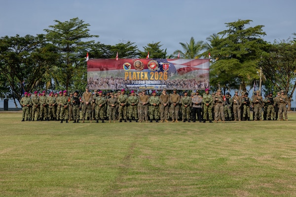 U.S. Marines with Alpha Company, 1st Battalion, 5th Marine Regiment, Marine Rotational Force – Darwin 26, and Indonesian marines with 7th Infantry Battalion, 4th Infantry Brigade, pose for a photo during an opening ceremony as part of a platoon exchange at the Indonesian Marine Corps 7th Battalion base near Lampung, Indonesia, Aug. 12, 2026.