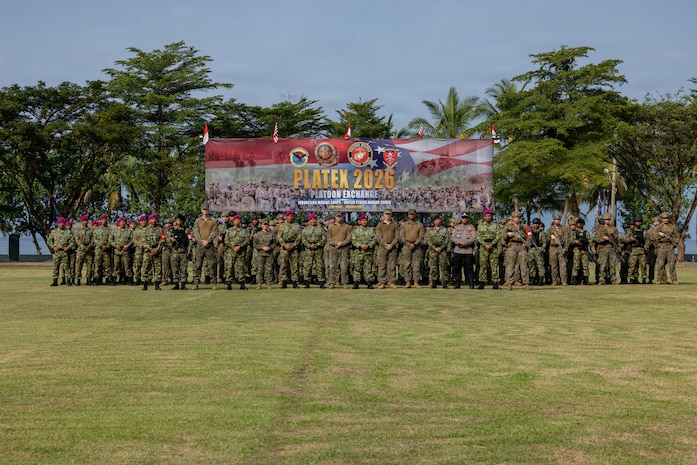 U.S. Marines with Alpha Company, 1st Battalion, 5th Marine Regiment, Marine Rotational Force – Darwin 26, and Indonesian marines with 7th Infantry Battalion, 4th Infantry Brigade, pose for a photo during an opening ceremony as part of a platoon exchange at the Indonesian Marine Corps 7th Battalion base near Lampung, Indonesia, Aug. 12, 2026.