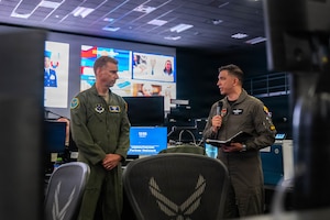 Colombian Aerospace Force Col. Andrés Galvis Espejo, Deputy Combined Force Air Component Commander for PANAMAX 2026, thanks U.S. Air Force Maj. Gen. David Mineau, 12th Air Force (Air Forces Southern) commander, for the opportunity to serve in the role, and addresses multinational participants in the Combined Air Operations Center at Davis-Monthan Air Force Base, Arizona, Aug. 3, 2026.