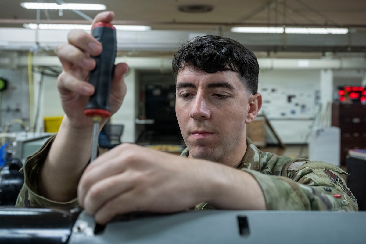 U.S. Air Force Senior Airman Jace Zuniga, 35th Maintenance Squadron avionics technician, conducts maintenance on an AN/ALQ-184(V) II Electronic Countermeasures (ECM) pod at Misawa Air Base, Japan, Aug. 5, 2026.