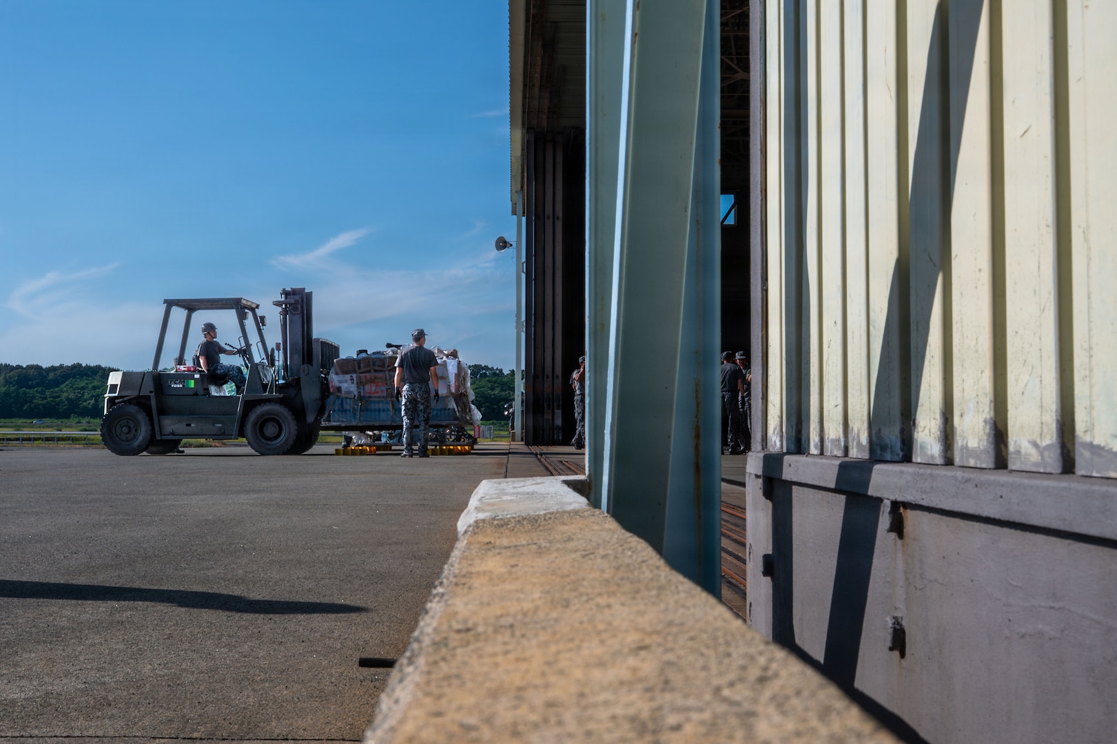 a forklift entering a warehouse