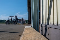 a forklift entering a warehouse