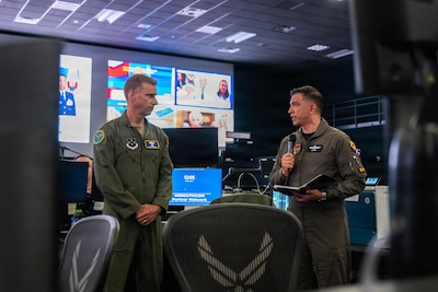 Colombian Aerospace Force Col. Andrés Galvis Espejo, Deputy Combined Force Air Component Commander for PANAMAX 2026, thanks U.S. Air Force Maj. Gen. David Mineau, 12th Air Force (Air Forces Southern) commander, for the opportunity to serve in the role, and addresses multinational participants in the Combined Air Operations Center at Davis-Monthan Air Force Base, Arizona, Aug. 3, 2026.