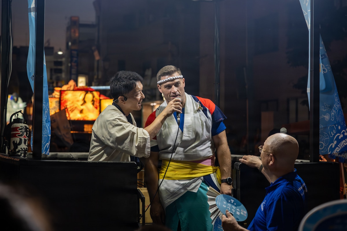 U.S. Air Force Col. Oliver Lause, right, 35th Fighter Wing commander, chants the phrase, “rassera, rassera” during a Nebuta Festival parade in Aomori City, Japan, Aug. 6, 2026. The engagement strengthened host-nation relationships that support integrated deterrence by reinforcing the community trust and allied cooperation needed to sustain U.S. presence and partnership in the Pacific. (U.S. Air Force photo by Senior Airman Andre Medina)