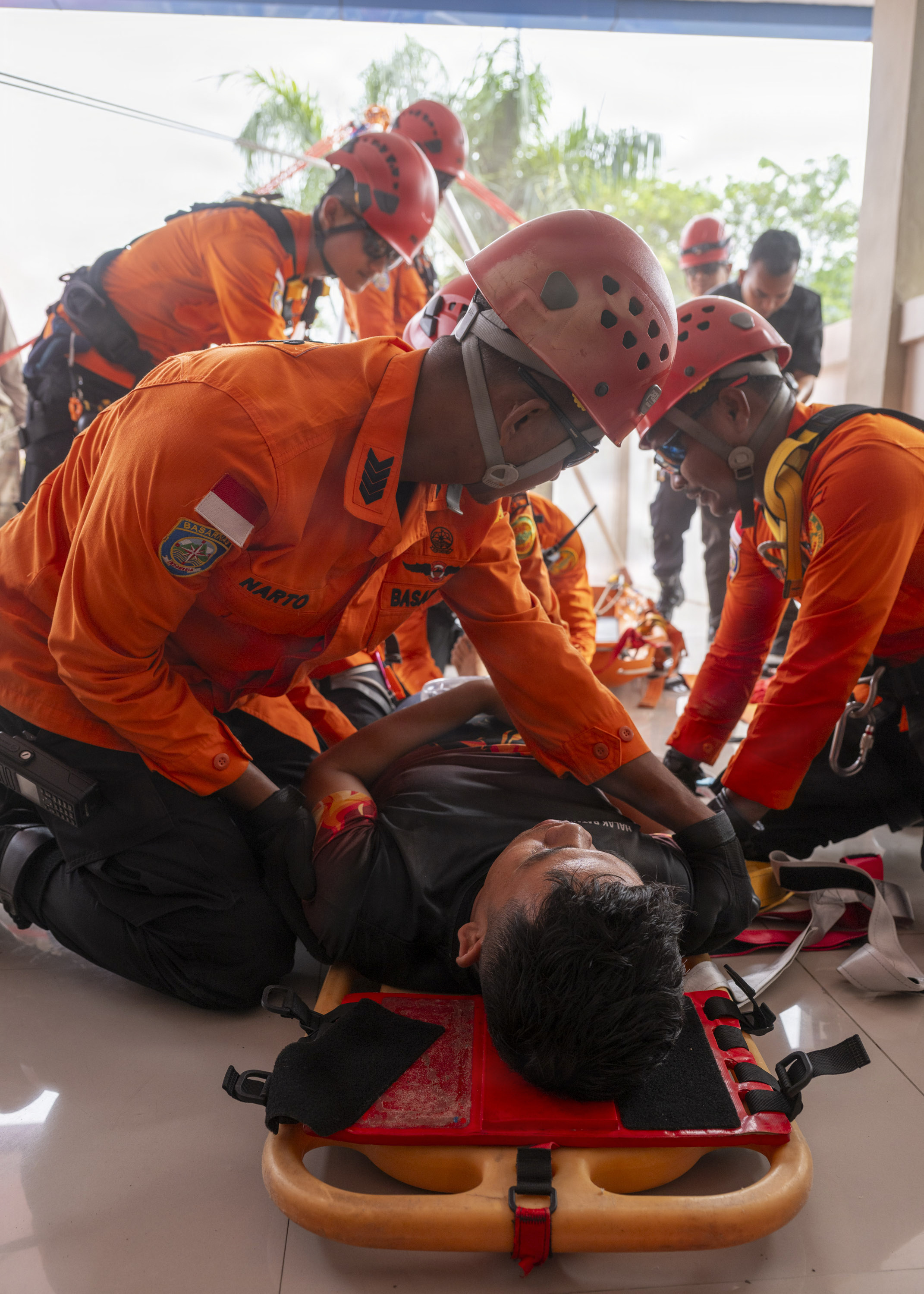 Members of the Indonesian National Search and Rescue secure a simulated casualty to a stretcher during a two-day PP26 humanitarian assistance and disaster preparedness field training exercise at Rumah Sakit FL Tobing Sibolga hospital in Sibolga, Indonesia, July 28, 2026.