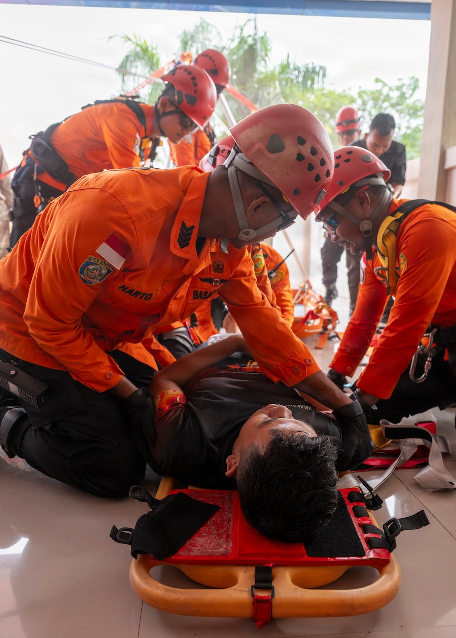 Members of the Indonesian National Search and Rescue secure a simulated casualty to a stretcher during a two-day PP26 humanitarian assistance and disaster preparedness field training exercise at Rumah Sakit FL Tobing Sibolga hospital in Sibolga, Indonesia, July 28, 2026.