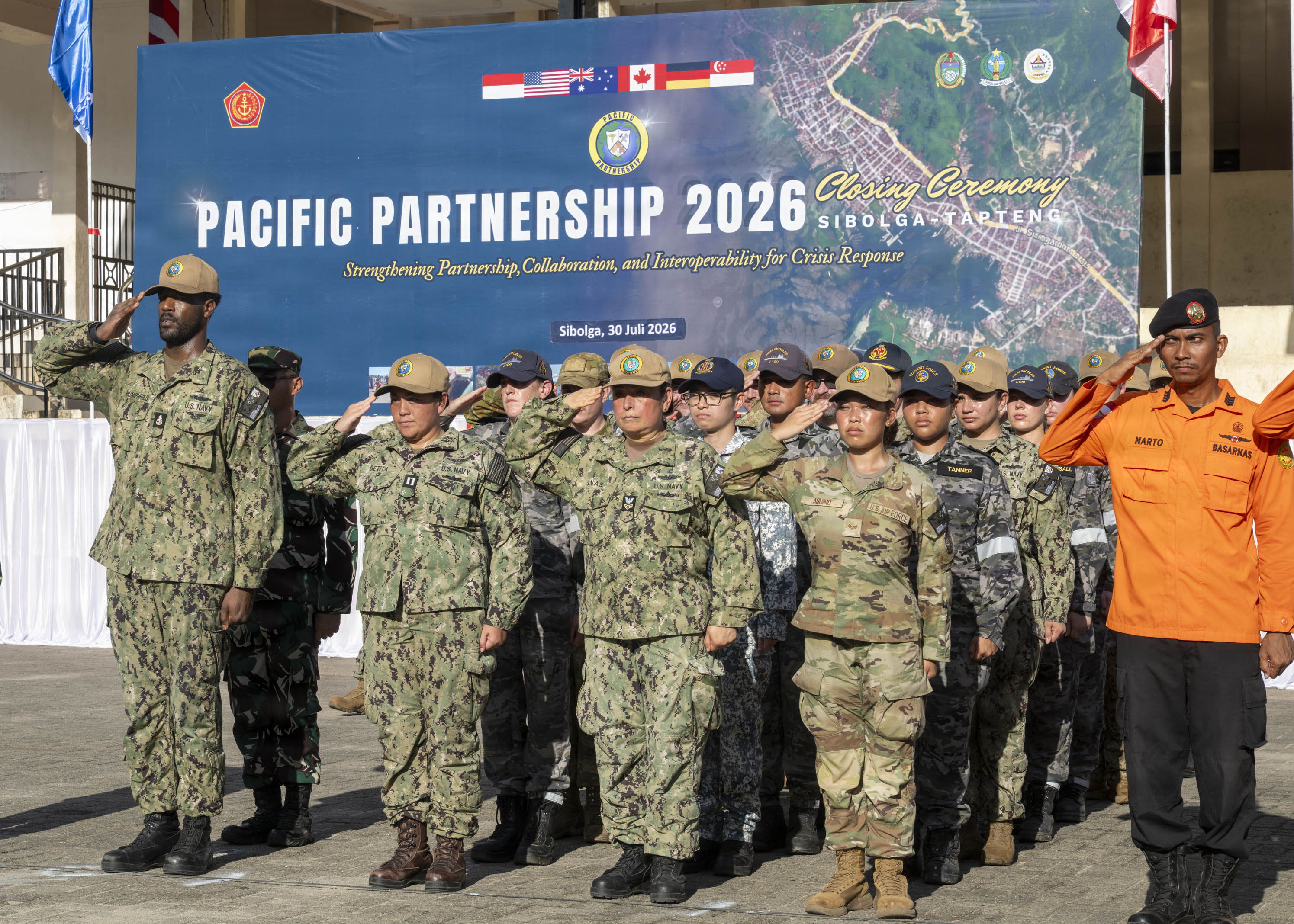 Pacific Partnership 2026 (PP26) personnel salute in formation during the PP26 Indonesia mission stop closing ceremony at Simare-Mare Field in Sibolga, Indonesia, July 30, 2026