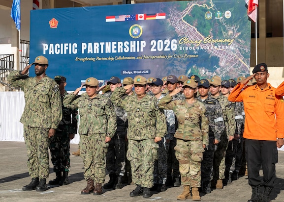 Pacific Partnership 2026 (PP26) personnel salute in formation during the PP26 Indonesia mission stop closing ceremony at Simare-Mare Field in Sibolga, Indonesia, July 30, 2026
