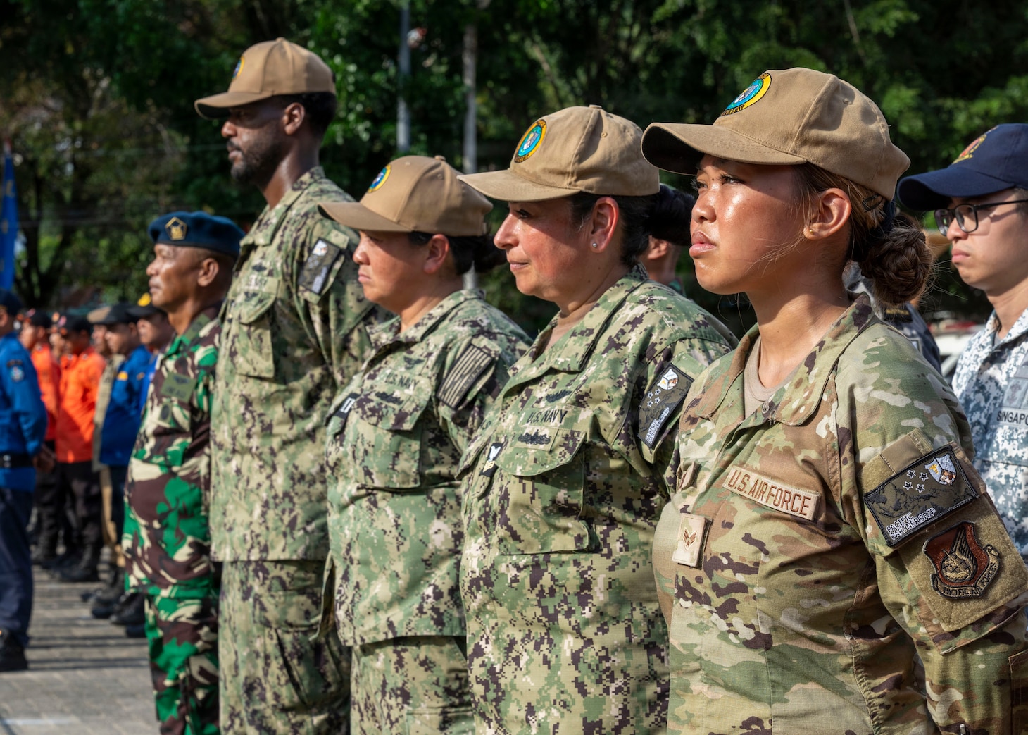Pacific Partnership 2026 (PP26) personnel stand in formation during the PP26 Indonesia mission stop closing ceremony at Simare-Mare Field in Sibolga, Indonesia, July 30, 2026