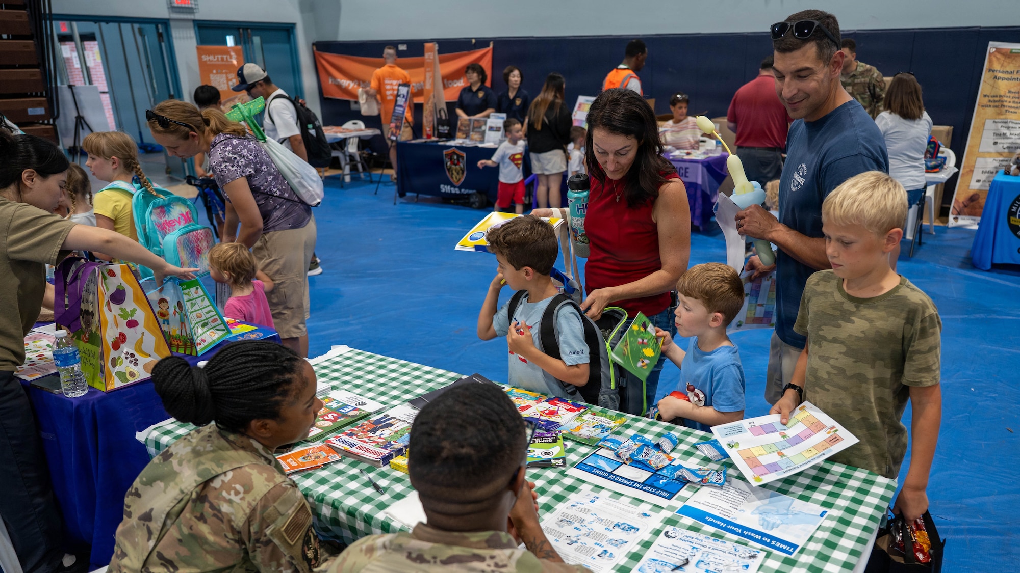 Military families participate in the “Back to School, Ready, Set, Grow” event at Osan Air Base, Republic of Korea, Aug. 11, 2026. The event connected families with helping agencies and community organizations while providing resources to support students and families as they begin a new school year. (U.S. Air Force photo by Senior Airman Megan Cusmano)
