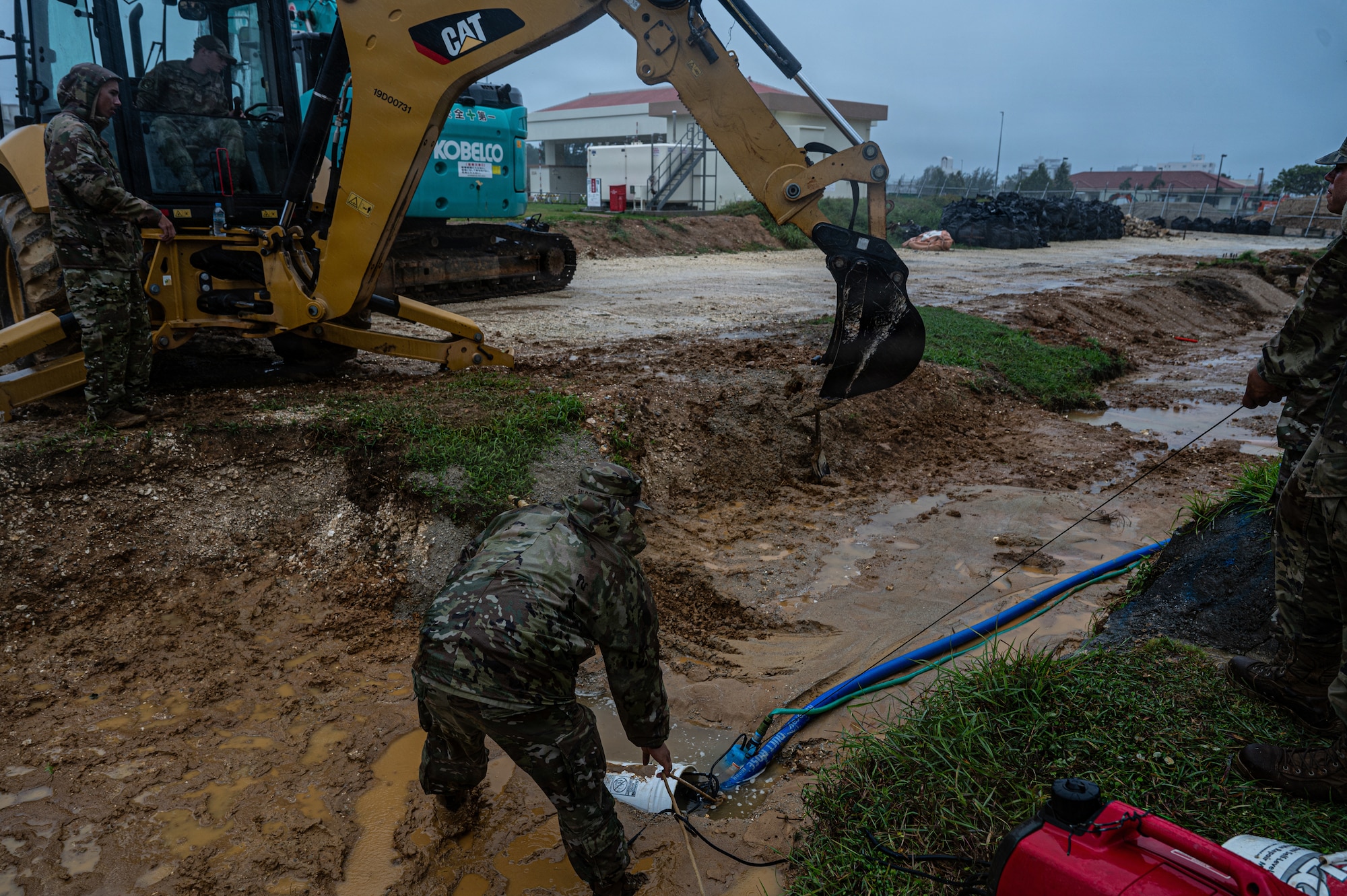 Airman prepare a site for water line recovery.