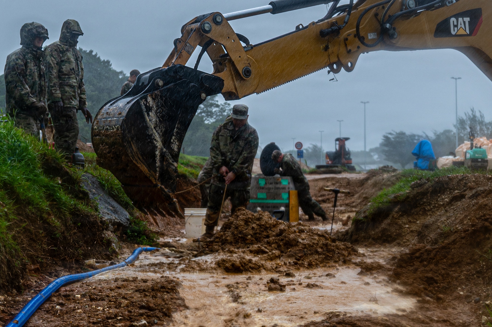 Airmen prepare a site for water line recovery.