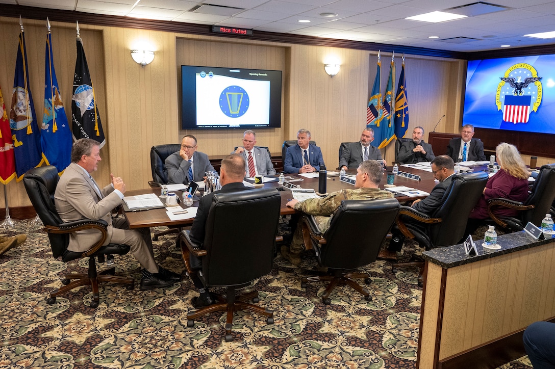 Defense Logistics Agency Vice Director Brad Bunn (far left) talks with DLA Disposition Services staff at the Hart-Dole-Inouye Federal Center in Battle Creek, Michigan on August 11, 2026.