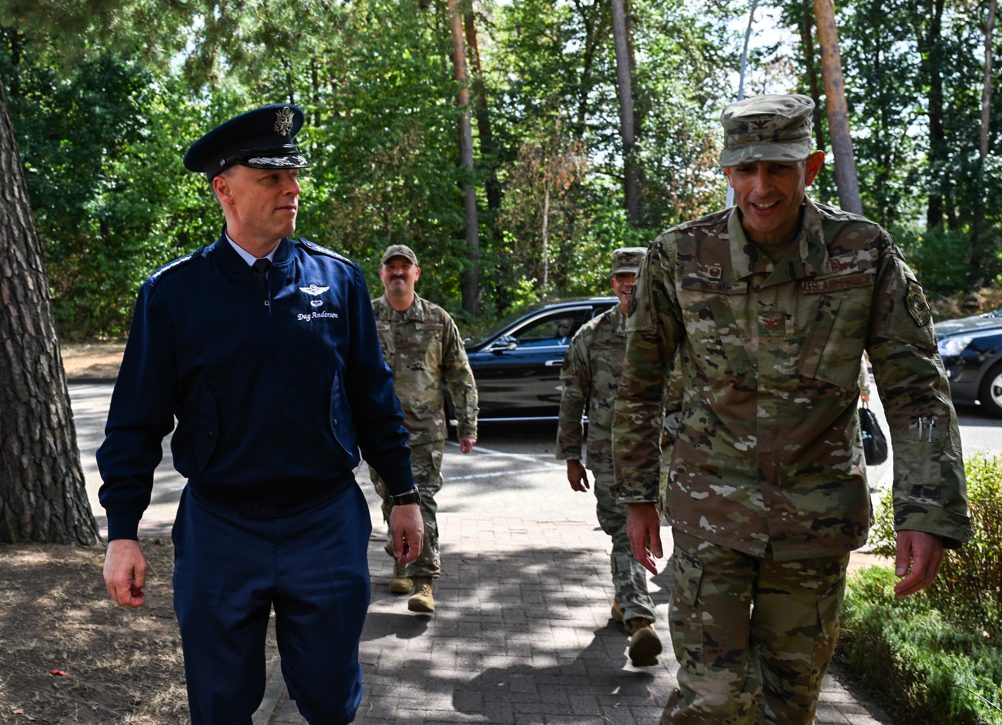 U.S. Air Force Gen. Dagvin Anderson, commander, U.S. Africa Command, left, and U.S. Air Force Col. Gabriel Brown, 406th Air Expeditionary Wing commander, right, walk into the 406th AEW headquarters building ahead of a wing visit at Ramstein Air Base, Germany, August 10, 2026. The 406th AEW provided Anderson an immersion and overview of their role as the only U.S. Air Force wing on the African continent and how they support combatant command objectives. (U.S. Air Force photo by Capt. Benjamin Aronson)
