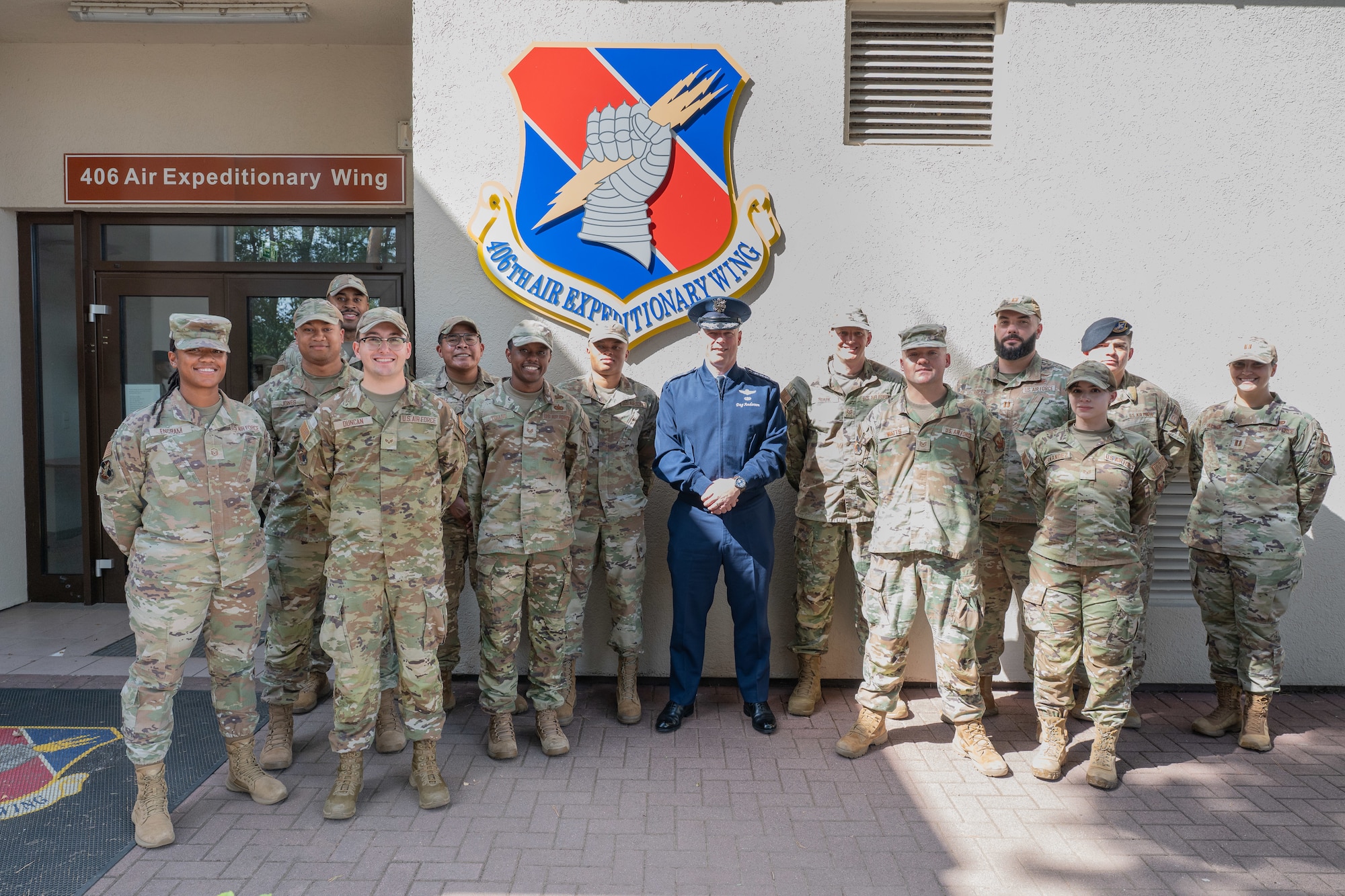 U.S. Air Force Gen. Dagvin Anderson, commander, U.S. Africa Command, center, poses for a group photo with Airmen from each of the 406th Air Expeditionary Wing directorates at the end of a wing immersion at Ramstein Air Base, Germany, August 10, 2026. The 406th AEW provided Anderson an immersion and overview of their role as the only U.S. Air Force wing on the African continent and how they support combatant command objectives. (U.S. Air Force photo by Capt. Benjamin Aronson)