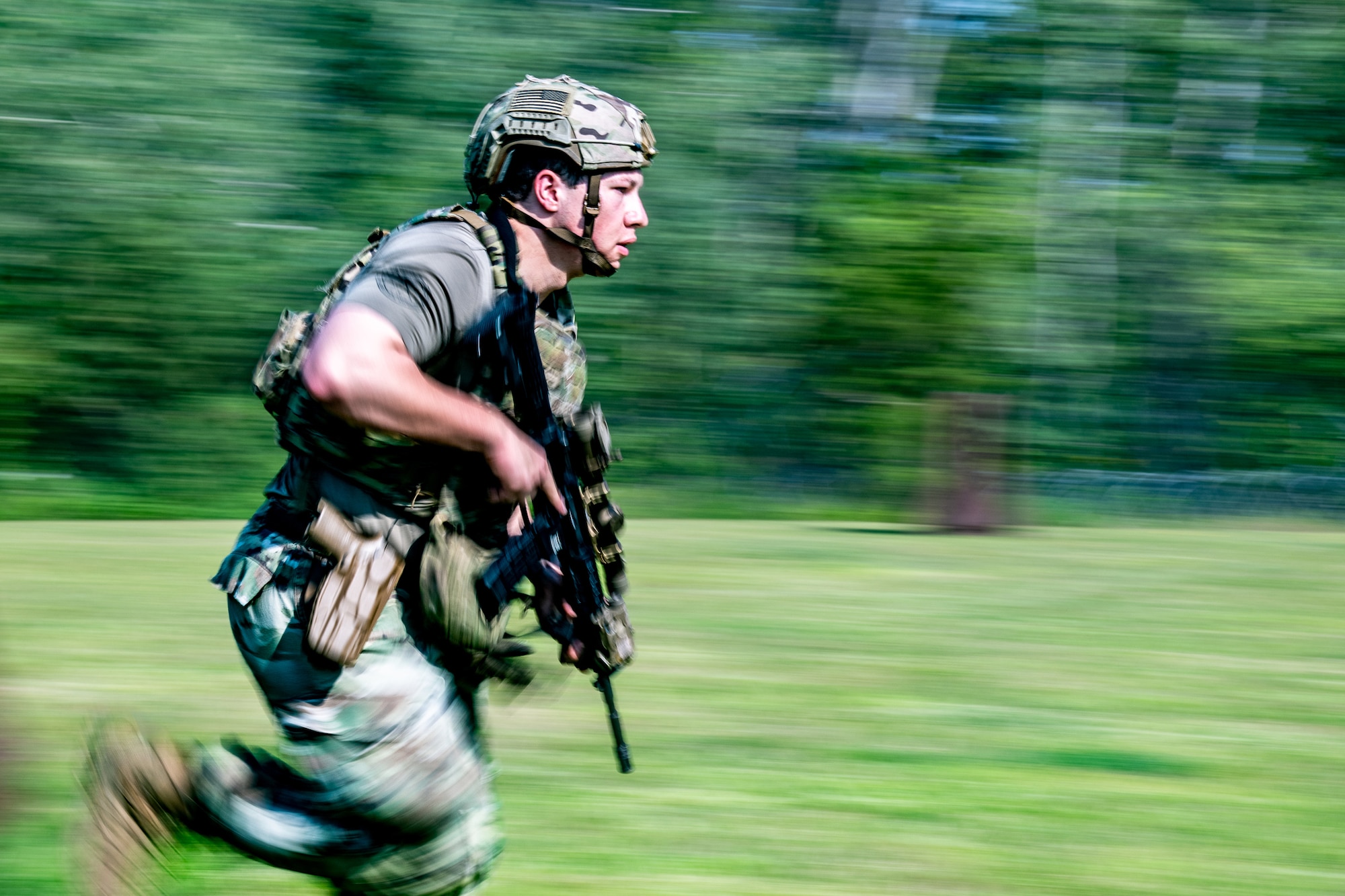 Image of Airman running with a weapon during exercise event.