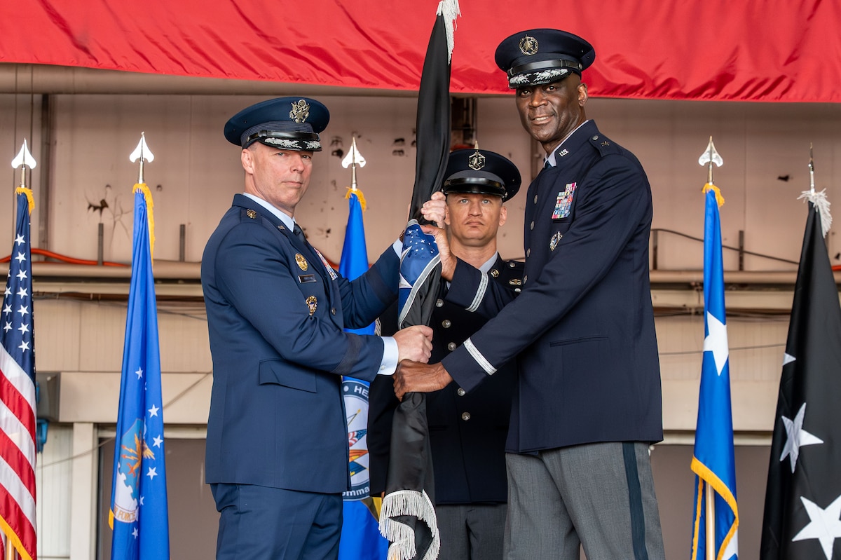 U.S. Space Force Brig. Gen. Jacob Middleton, U.S. Space Forces Europe – Space Forces Africa outgoing commander, passes the guide-on to relinquish command to U.S. Air Force Gen. Dagvin R.M. Anderson, commander, U.S. Africa Command