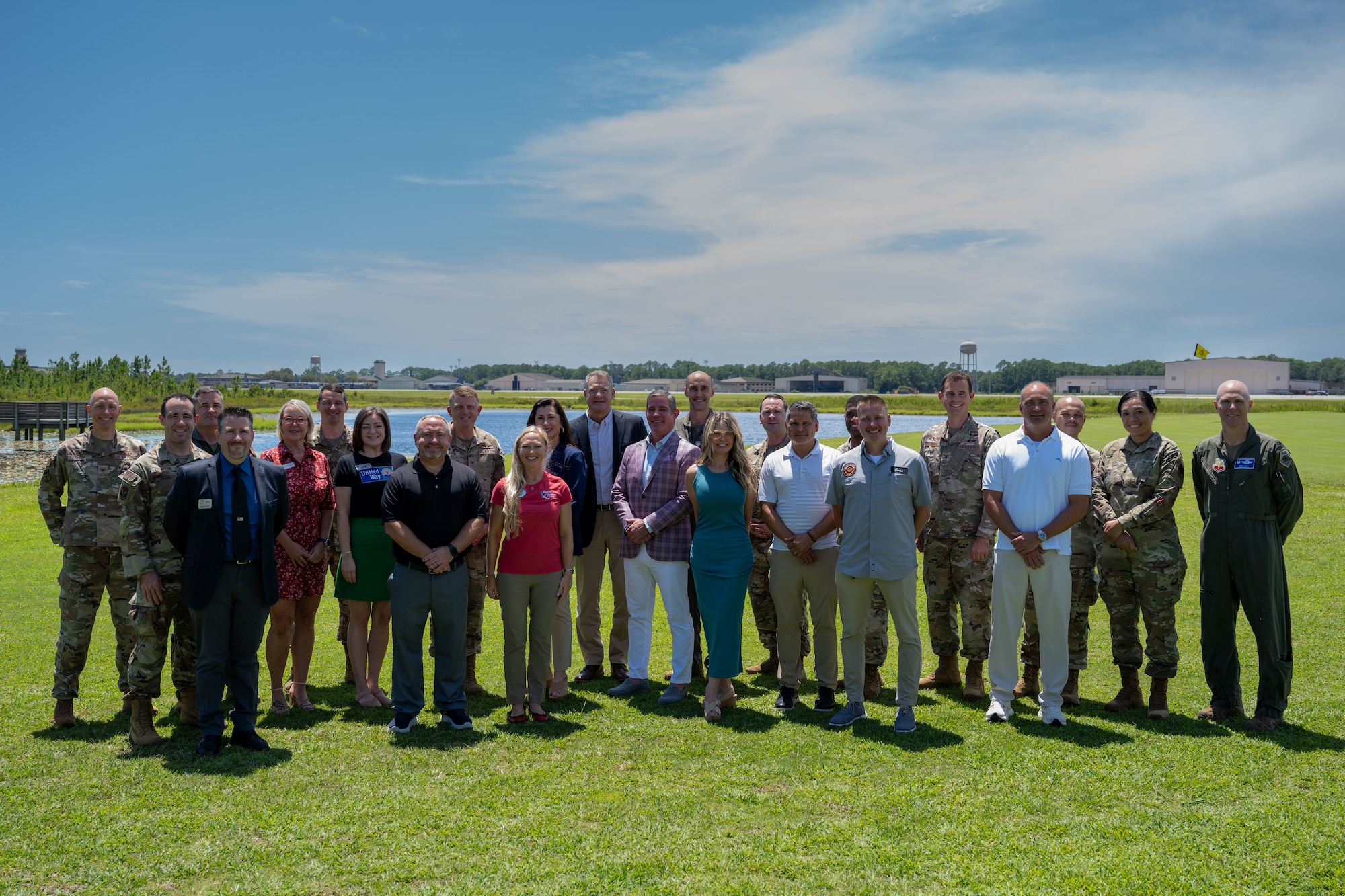 Hurlburt Field leadership and the newest class of honorary commanders pose for a photo during an orientation visit